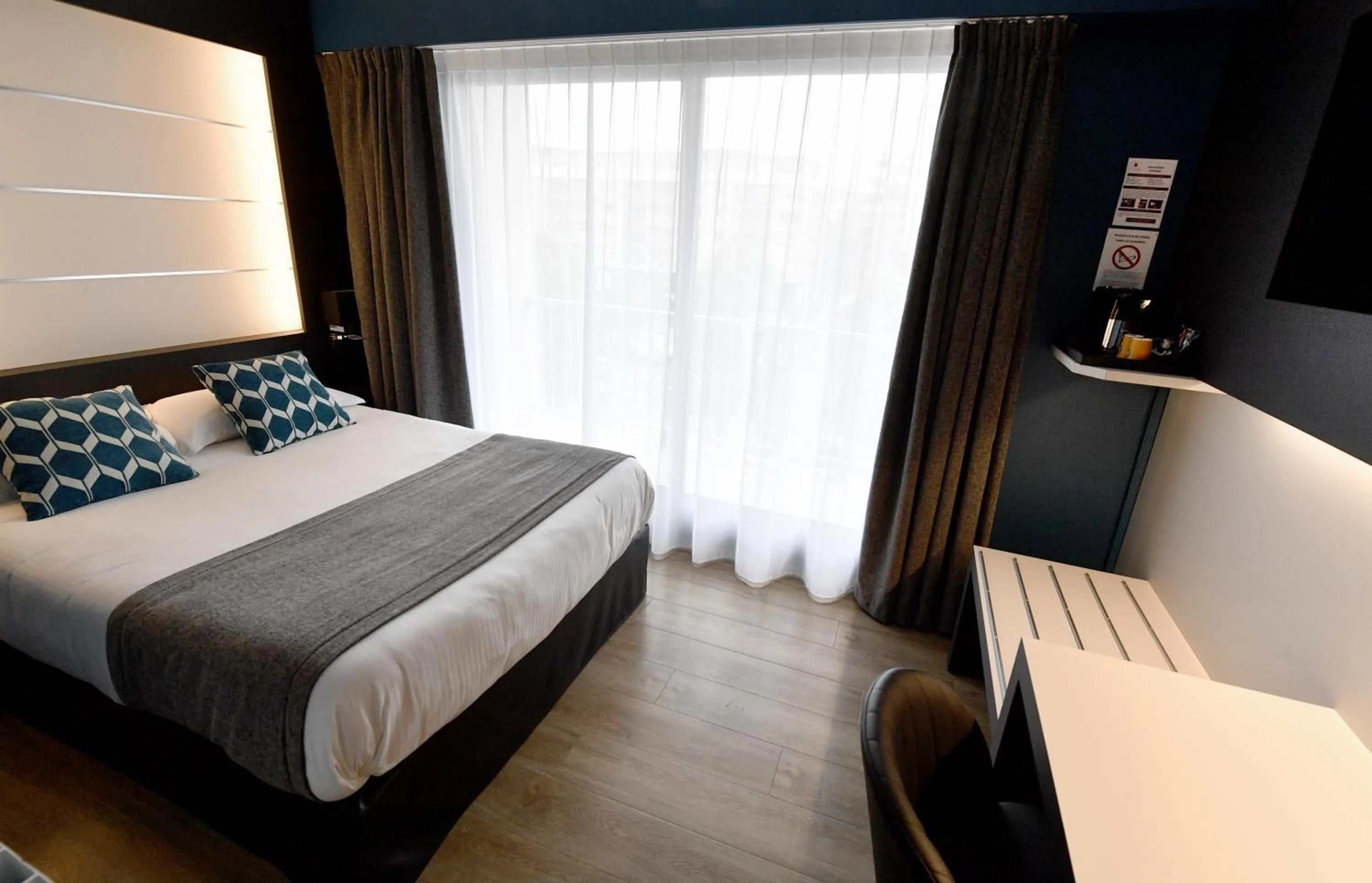 Bed in Hôtel Des Quatrans