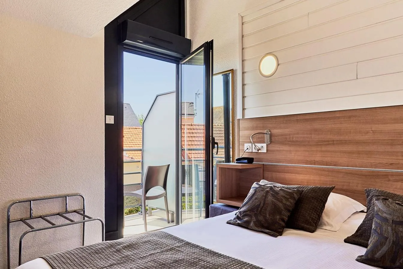 Bed in La Cremaillere Hôtel-Restaurant