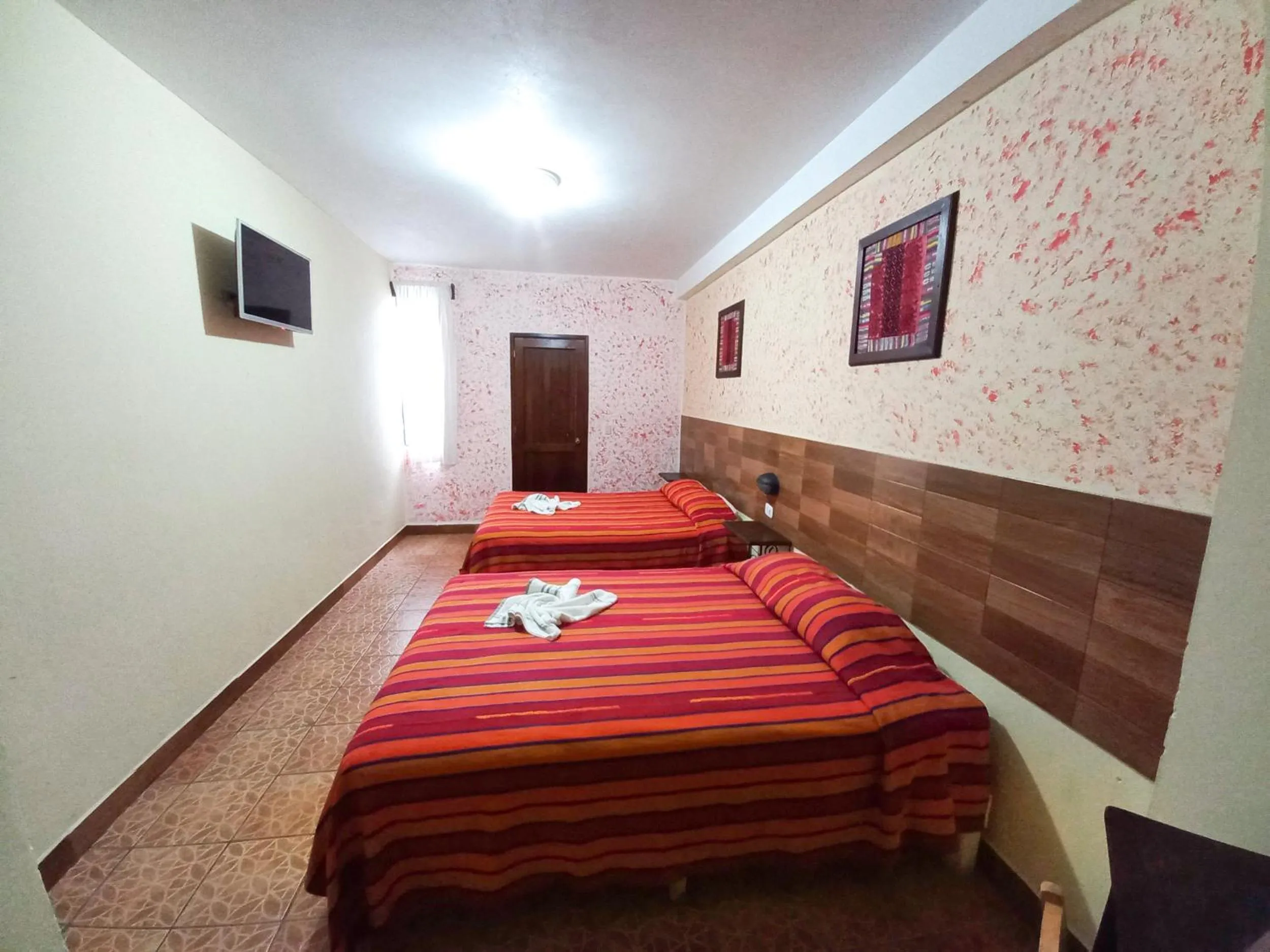 Photo of the whole room, Bed in Hotel Nakbé Atitlán