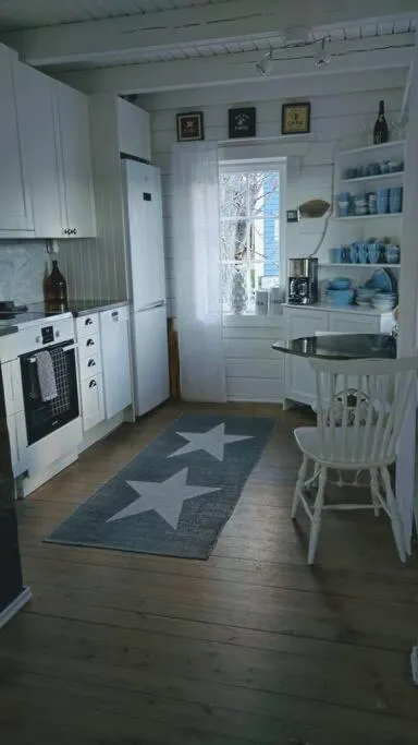 Kitchen or kitchenette in 3 Bedroom Cottage with Sauna by the Sea