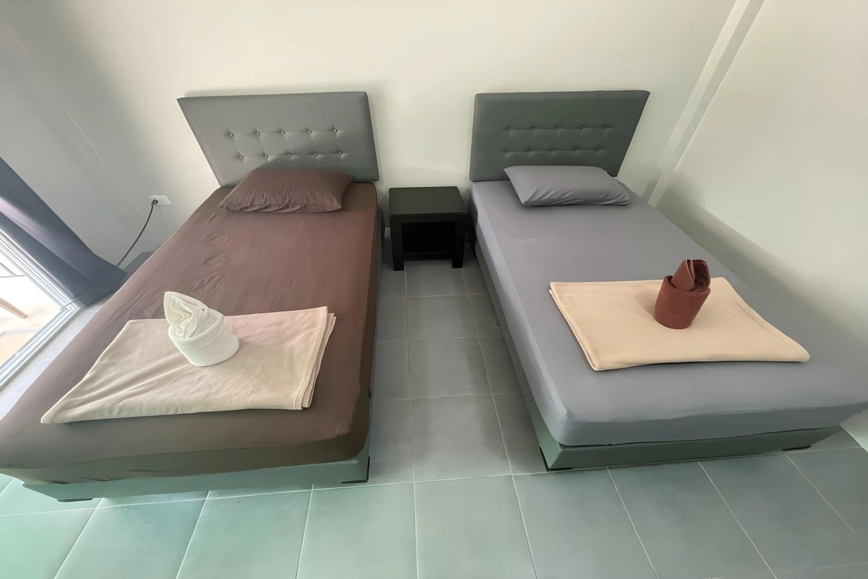 Bed in Davy Cottage Phuket