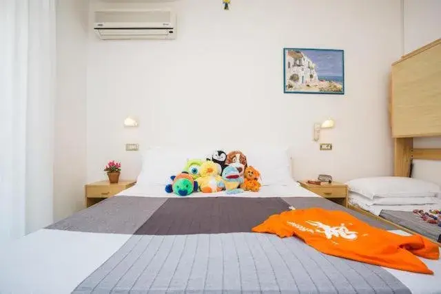 Bed in HOTEL TRE ROSE Bed in HOTEL TRE ROSE