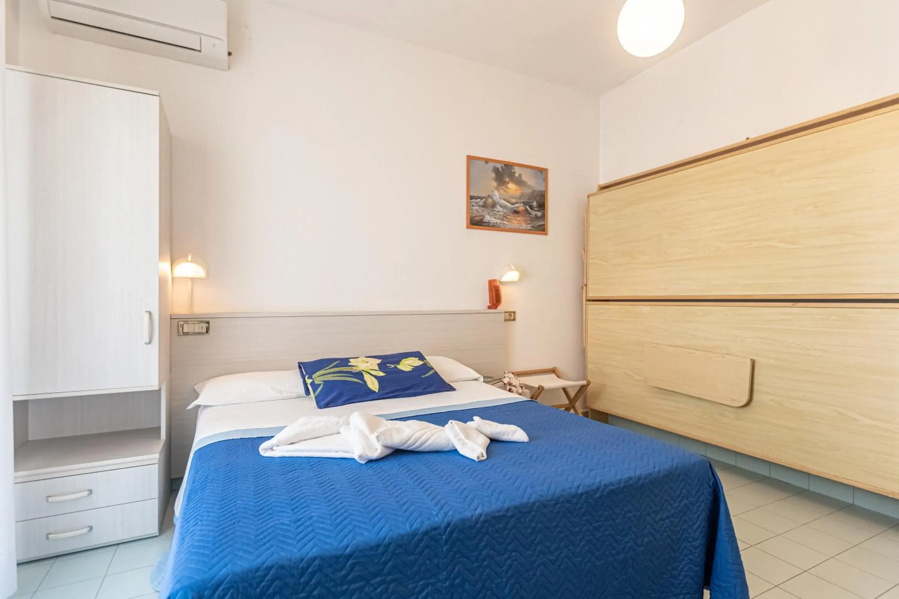 Bed in HOTEL TRE ROSE Bed in HOTEL TRE ROSE