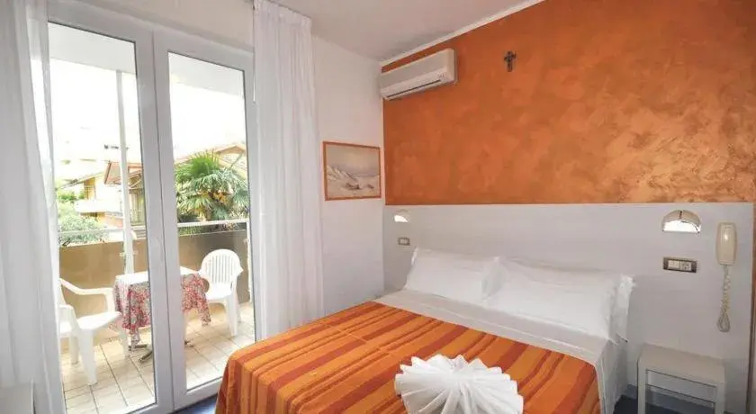 Bed in HOTEL TRE ROSE Bed in HOTEL TRE ROSE