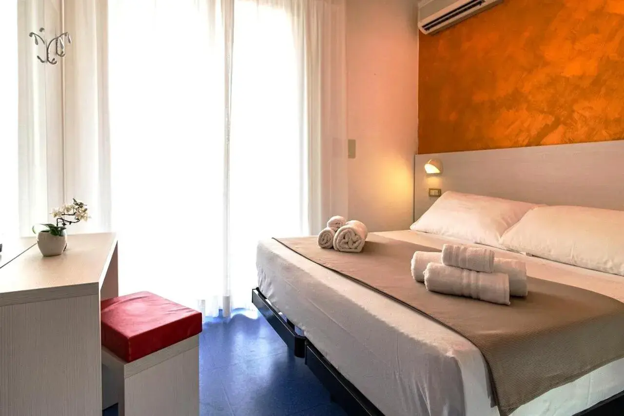 Bed in HOTEL TRE ROSE Bed in HOTEL TRE ROSE