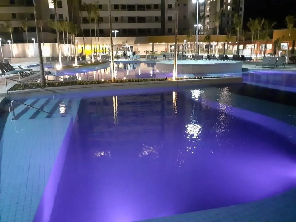 Swimming pool in Apartamento no Solar das Águas Resort em Olímpia - SP