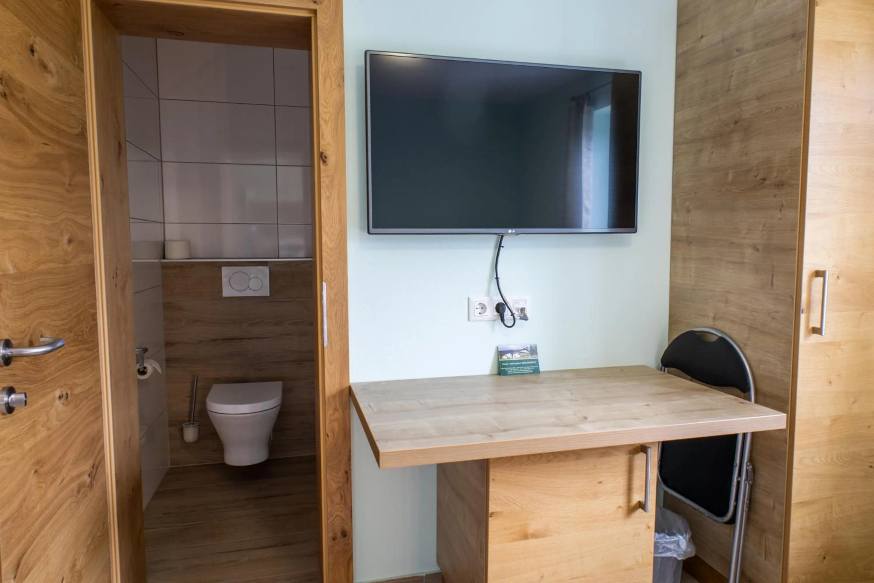 Communal lounge/ TV room in Gasthof Dreiländereck