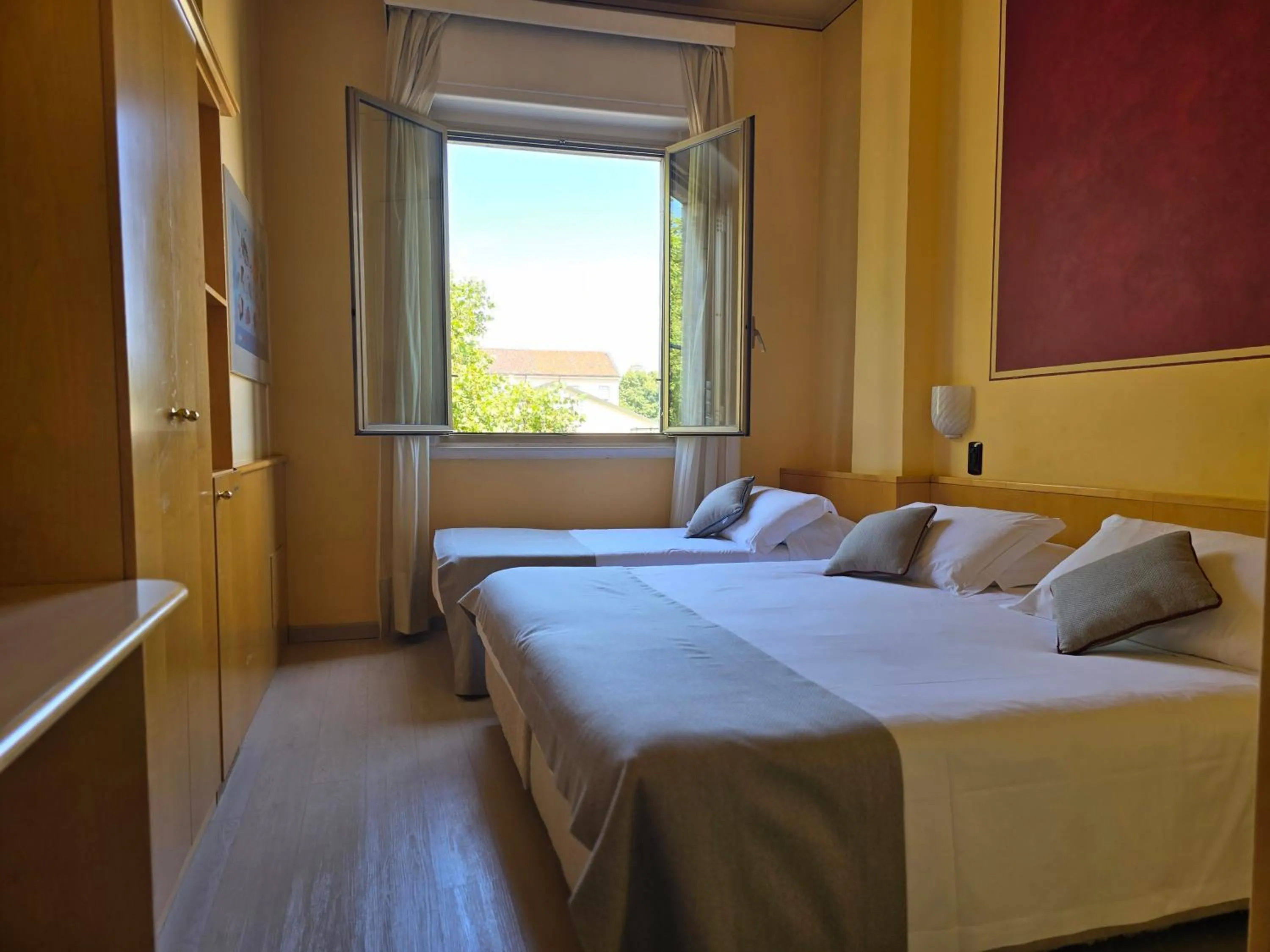 Photo of the whole room, Bed in Mokinba Hotels Sant'Ambroeus