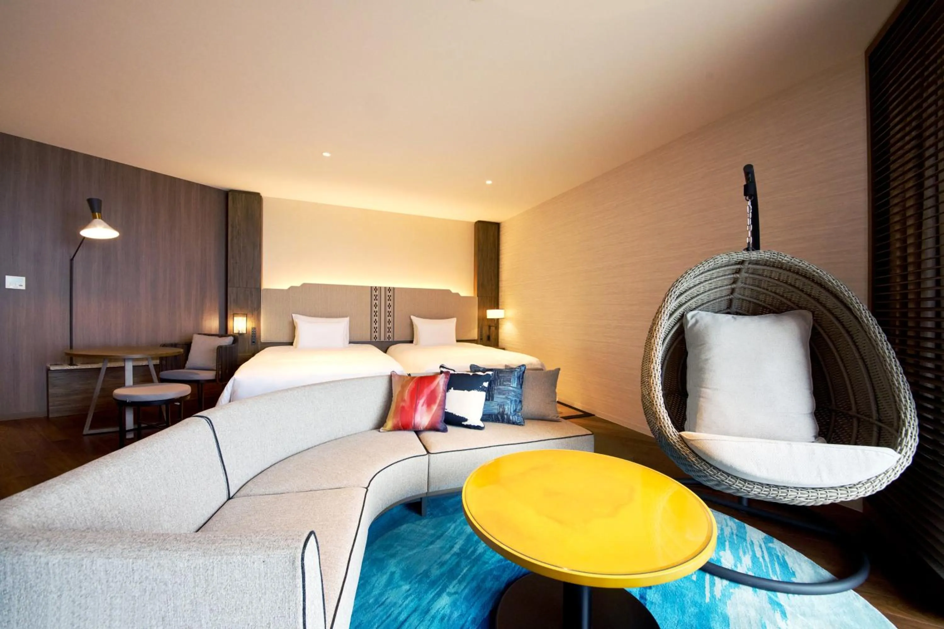 Seating area, Bed in Okinawa Prince Hotel Ocean View Ginowan