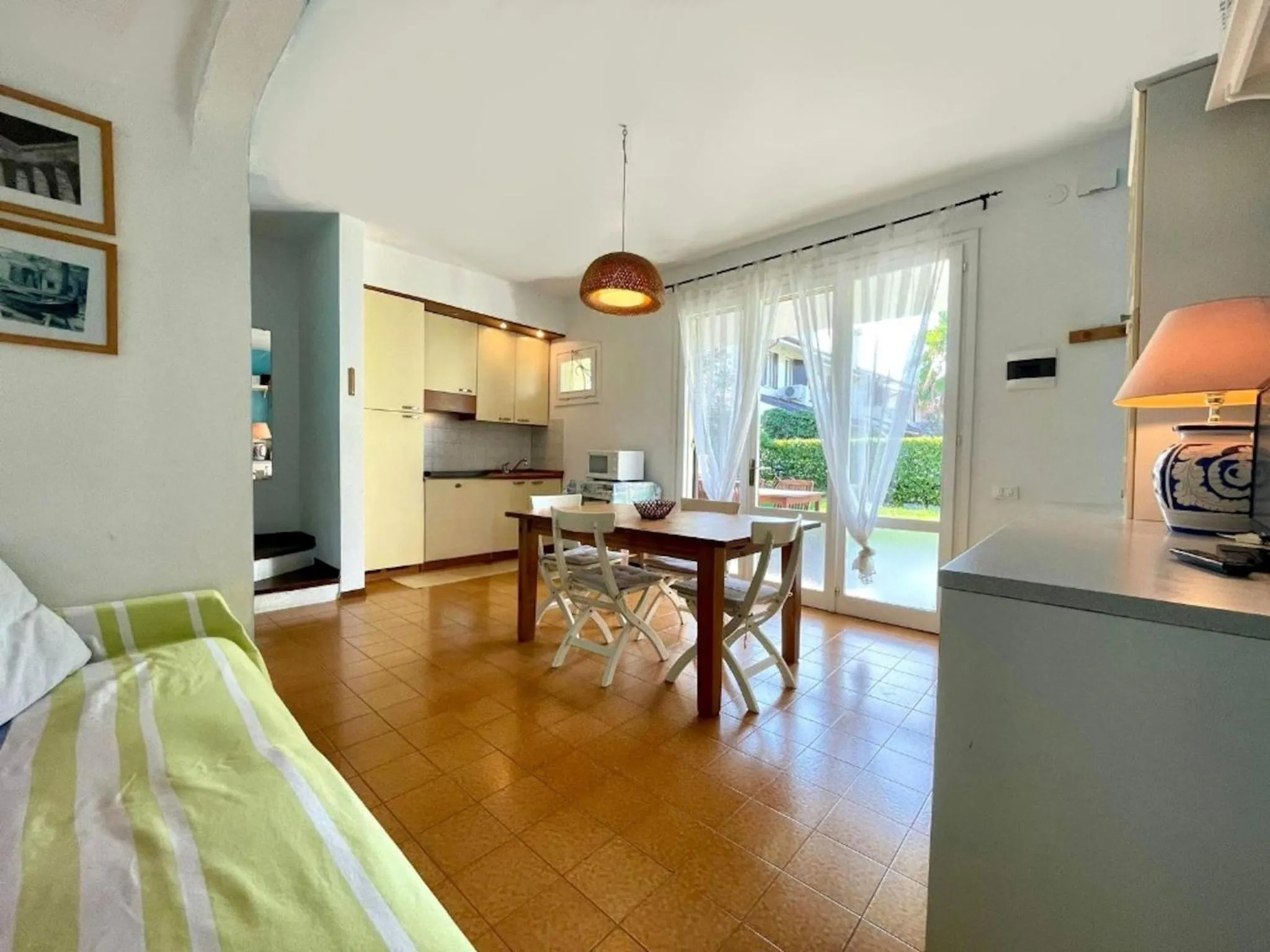 Bed in Colorful house with pool and garden