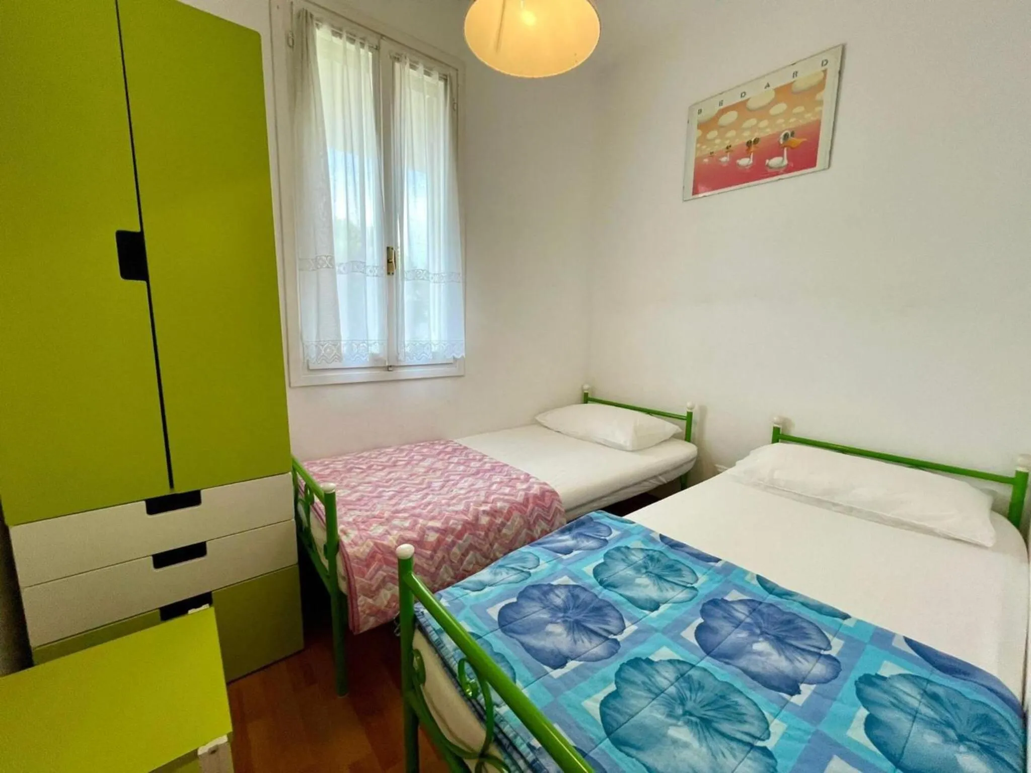 Bed in Colorful house with pool and garden