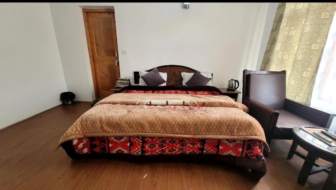 Bed in Hotel Malik Residency