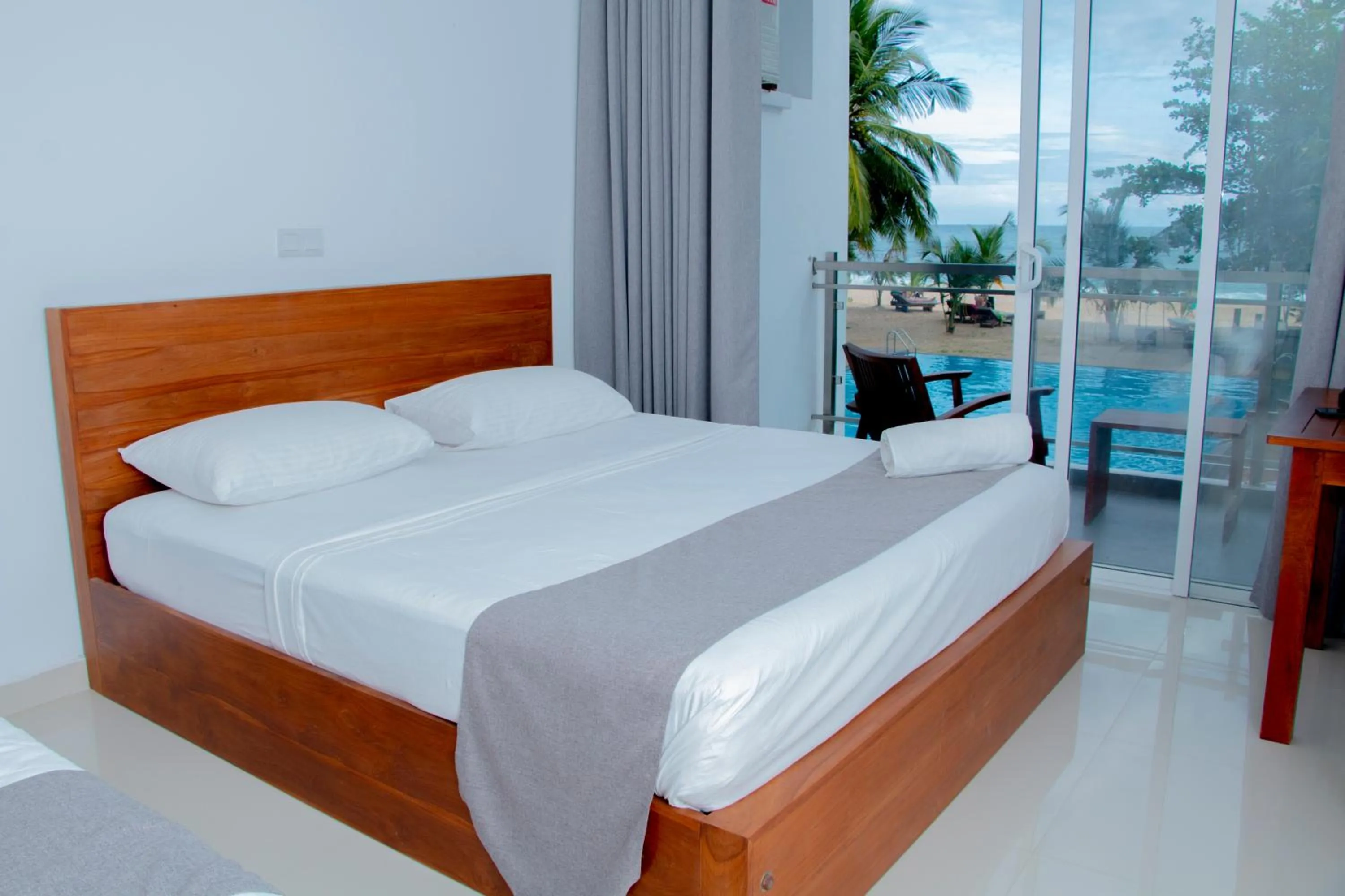 Bed in Marakolliya Beach Resort