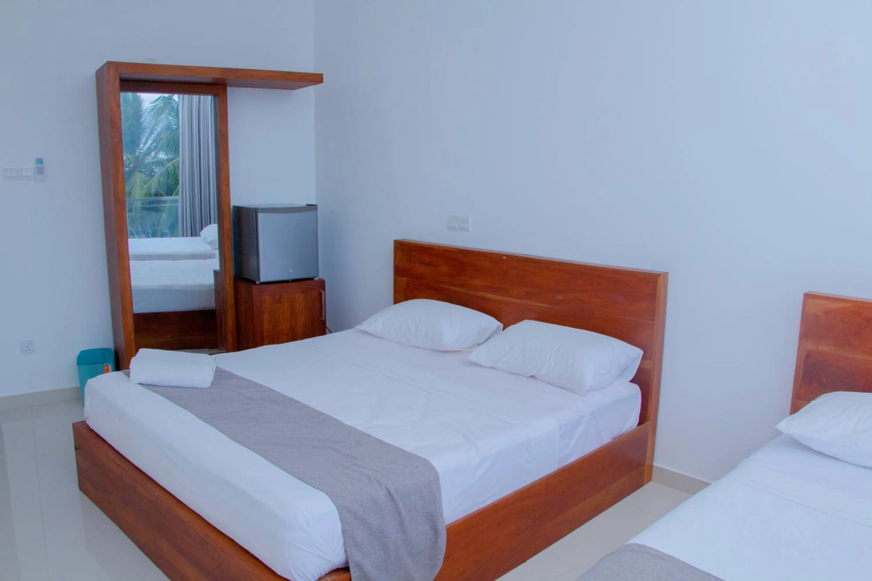 Bed in Marakolliya Beach Resort