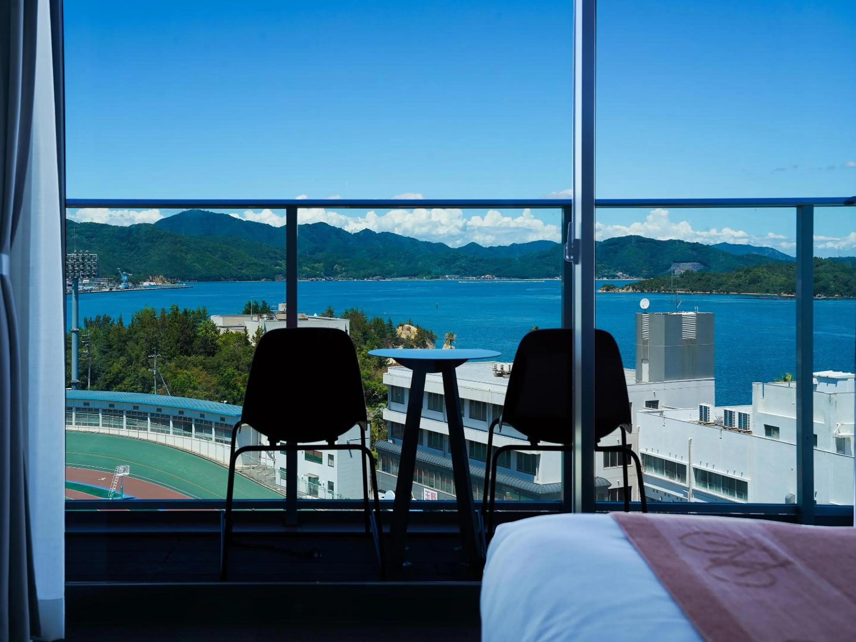 View (from property/room), Bed in SETOUCHI KEIRIN HOTEL 10 by Onko Chishin