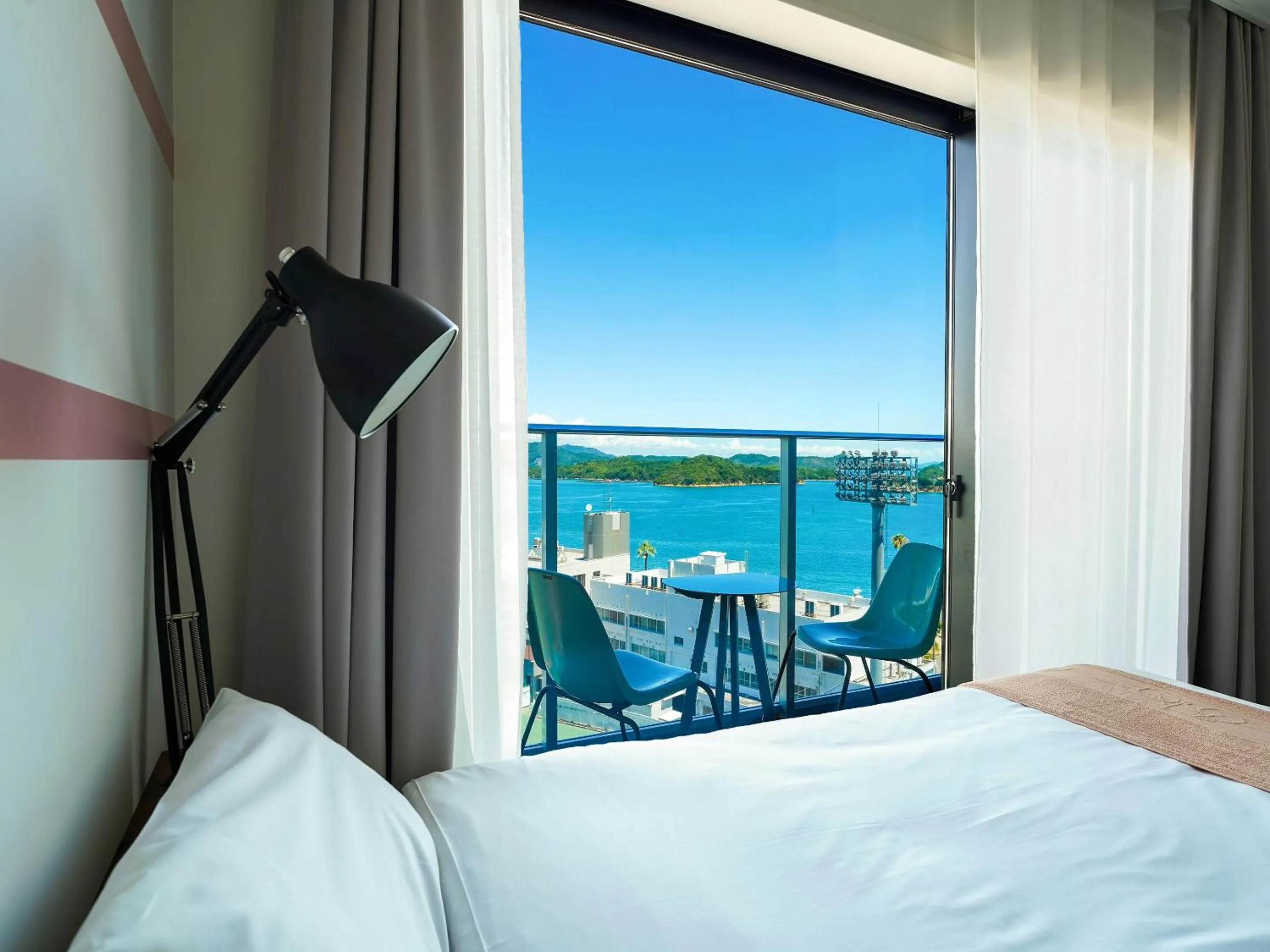 Photo of the whole room, Bed in SETOUCHI KEIRIN HOTEL 10 by Onko Chishin