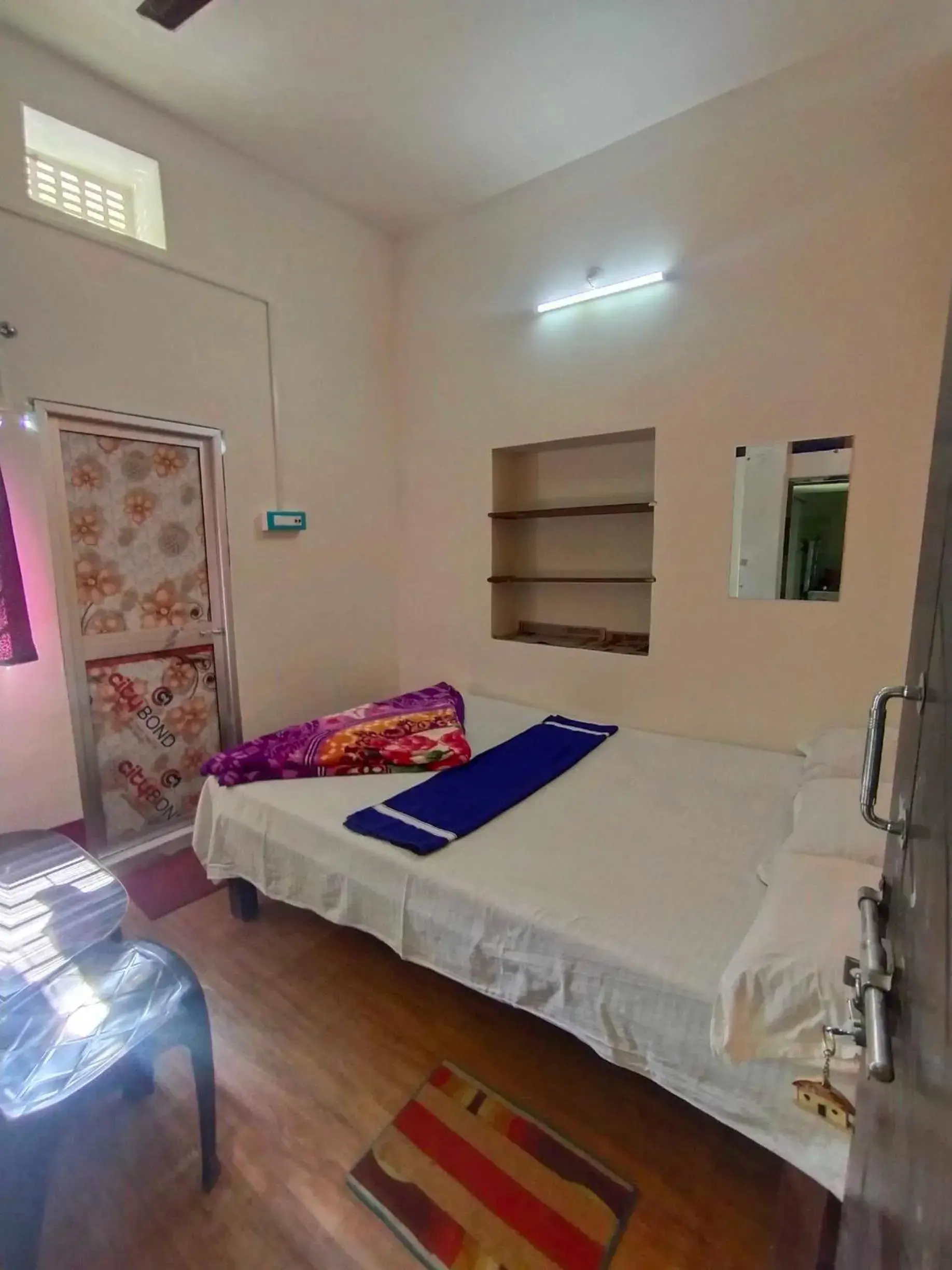 Bedroom in SPOT ON Ganguly Hotel Lodging And Fooding Bedroom in SPOT ON Ganguly Hotel Lodging And Fooding