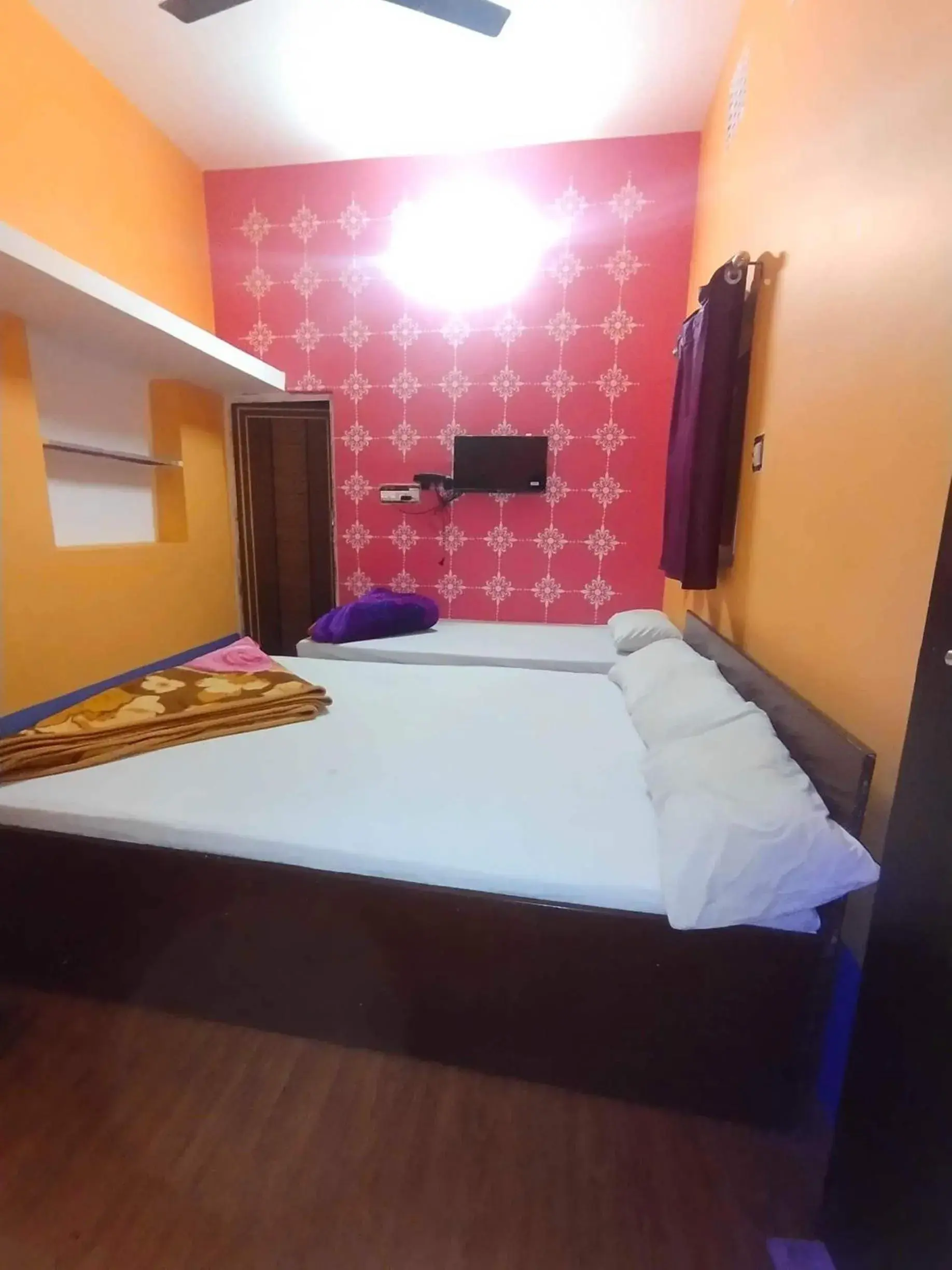 Bedroom in SPOT ON Ganguly Hotel Lodging And Fooding Bedroom in SPOT ON Ganguly Hotel Lodging And Fooding