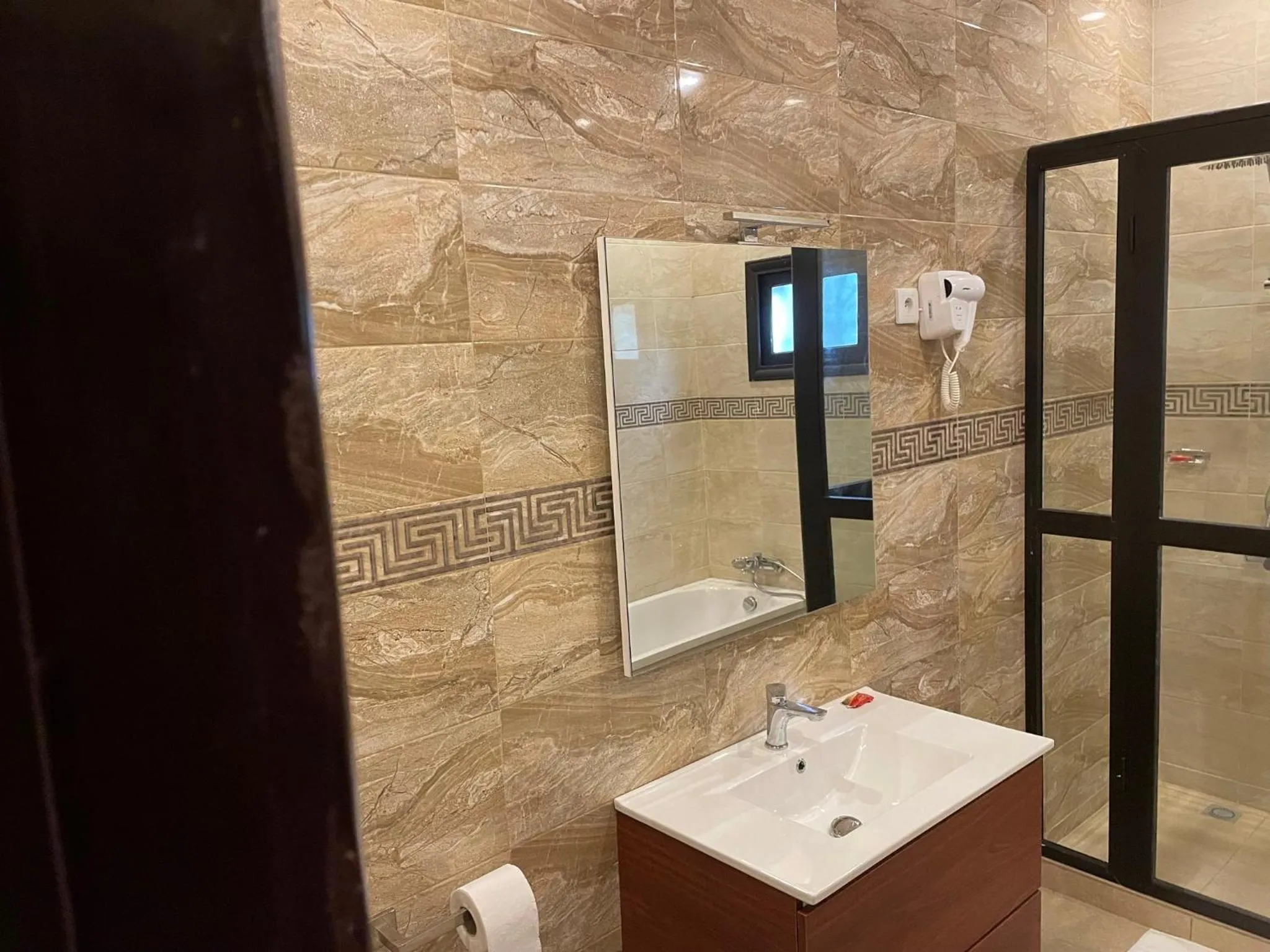 Shower in HOTEL LES ARCADES