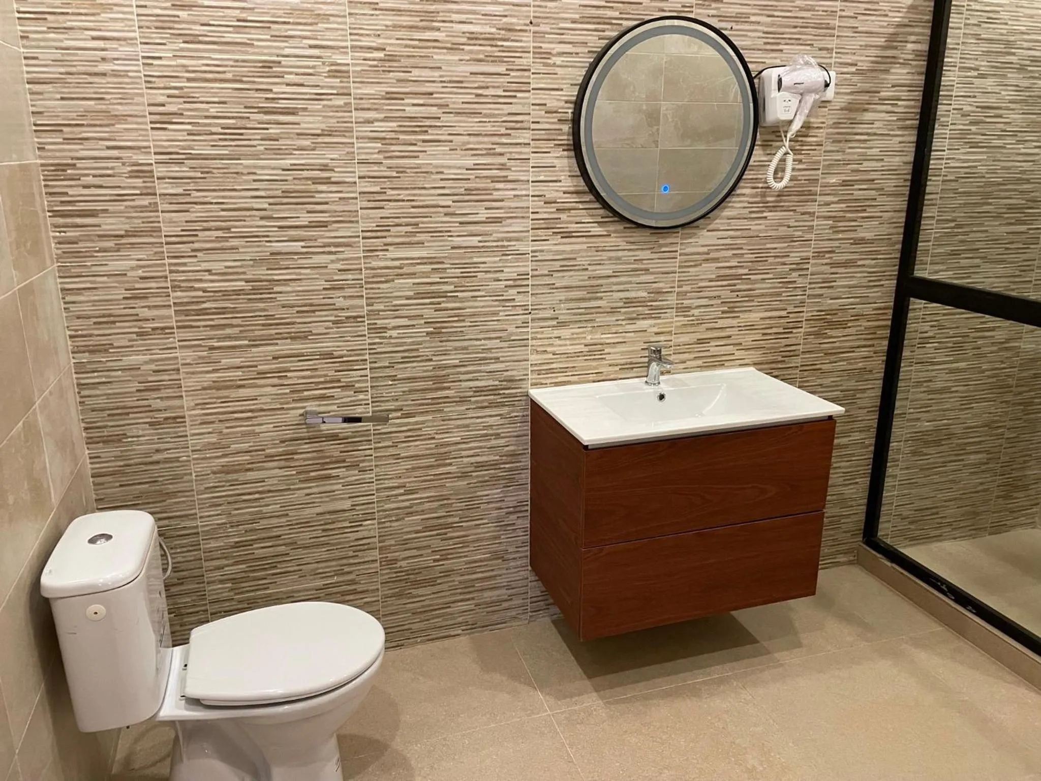 Shower in HOTEL LES ARCADES