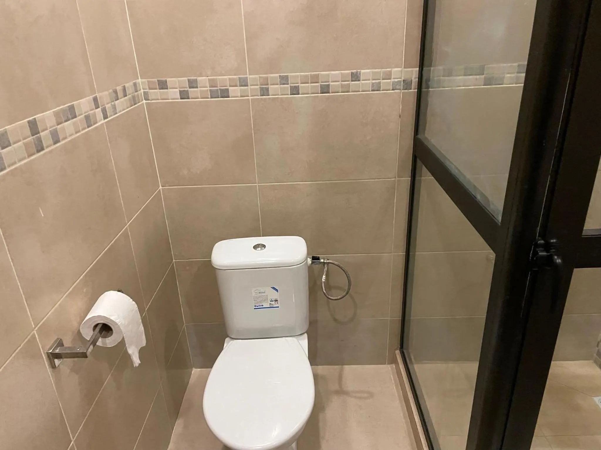 Shower in HOTEL LES ARCADES