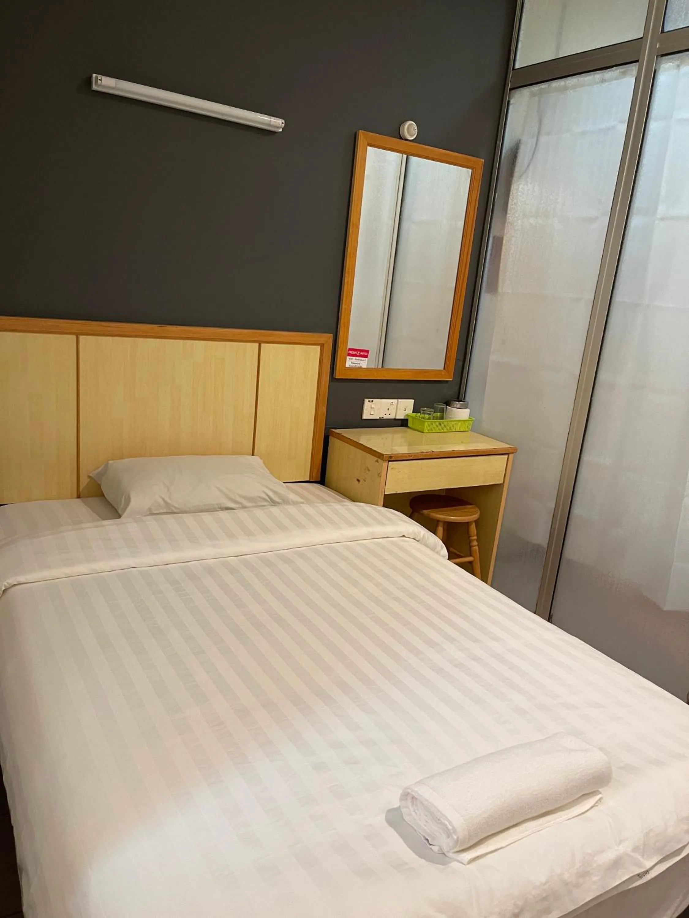 Bed in Fresh Hotel Falim