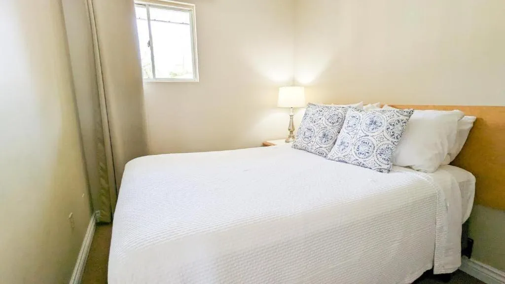 Bed in Oasis by the Bay Vacation Suites