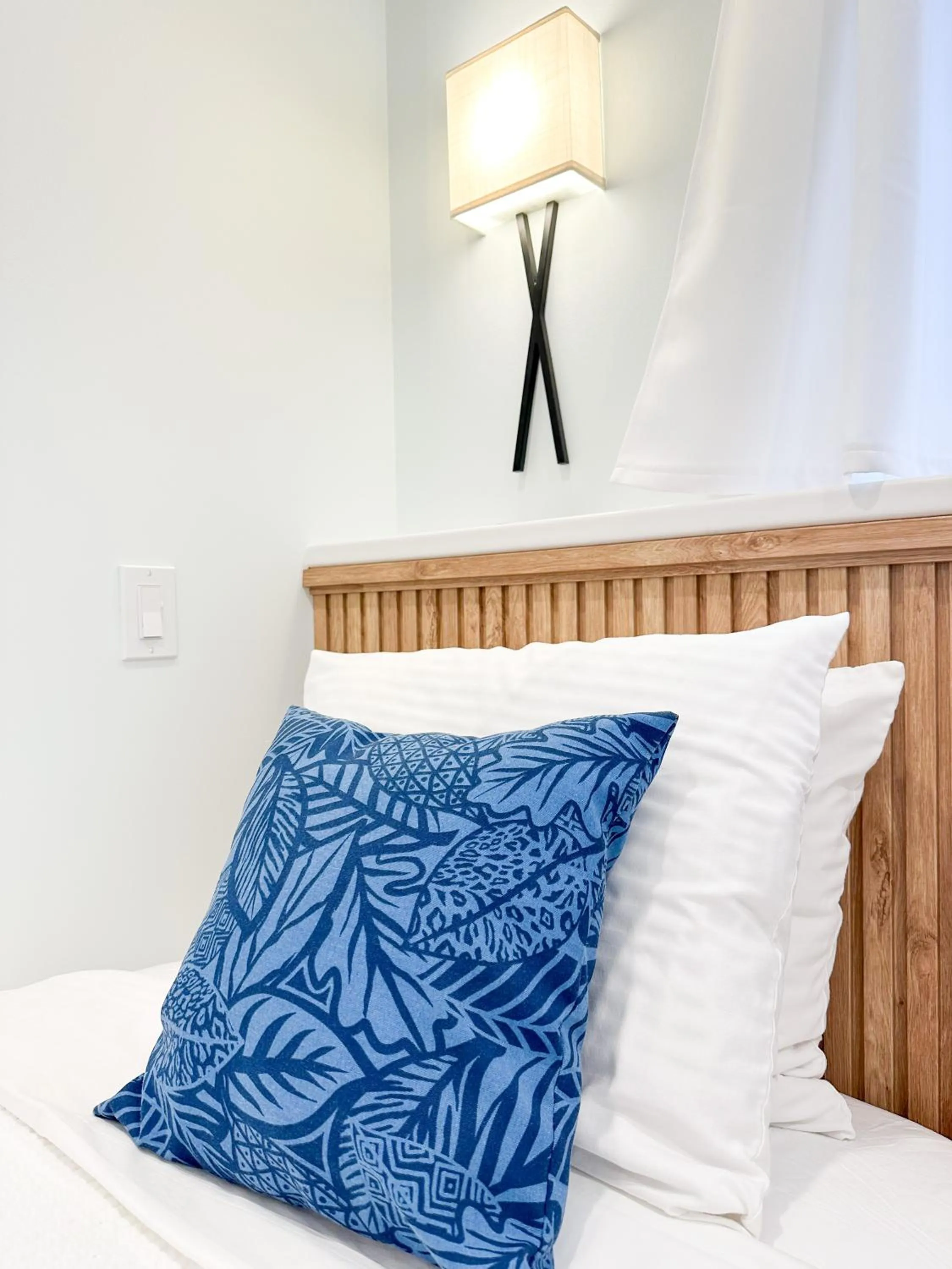 Bed in Oasis by the Bay Vacation Suites