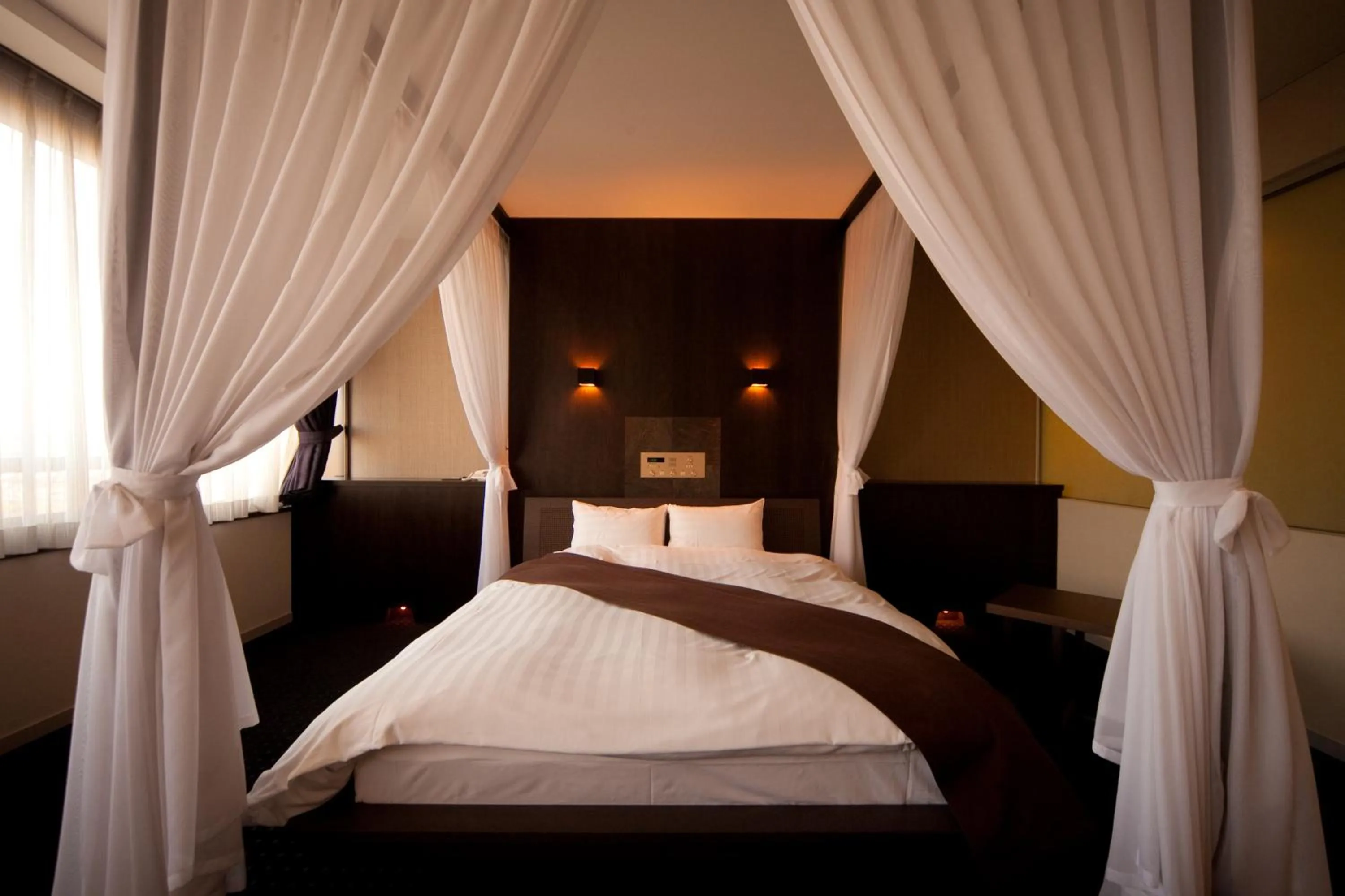 Bed in Kikunan Onsen Yubel Hotel