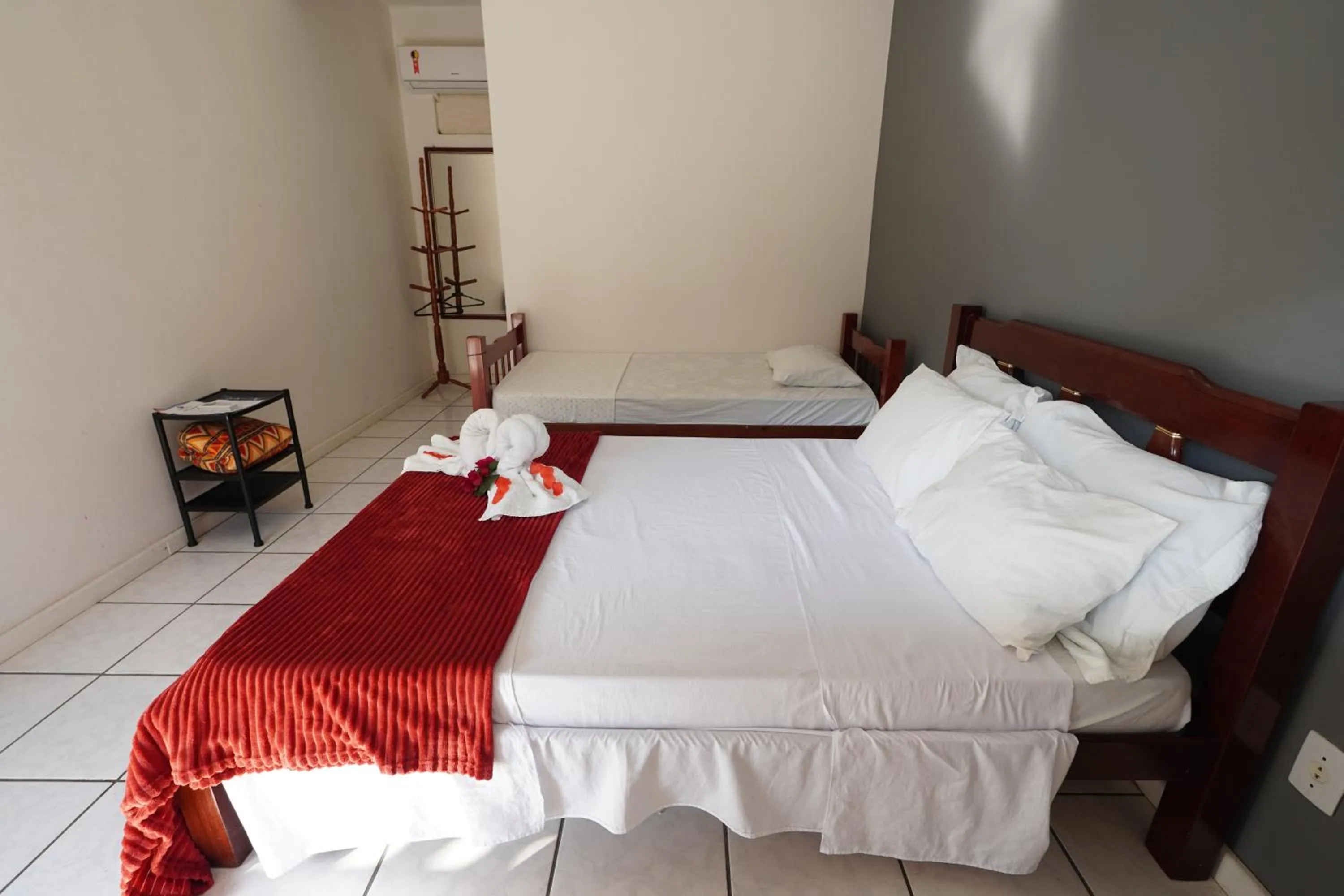 Bed in Pousada Frezza Mergulho