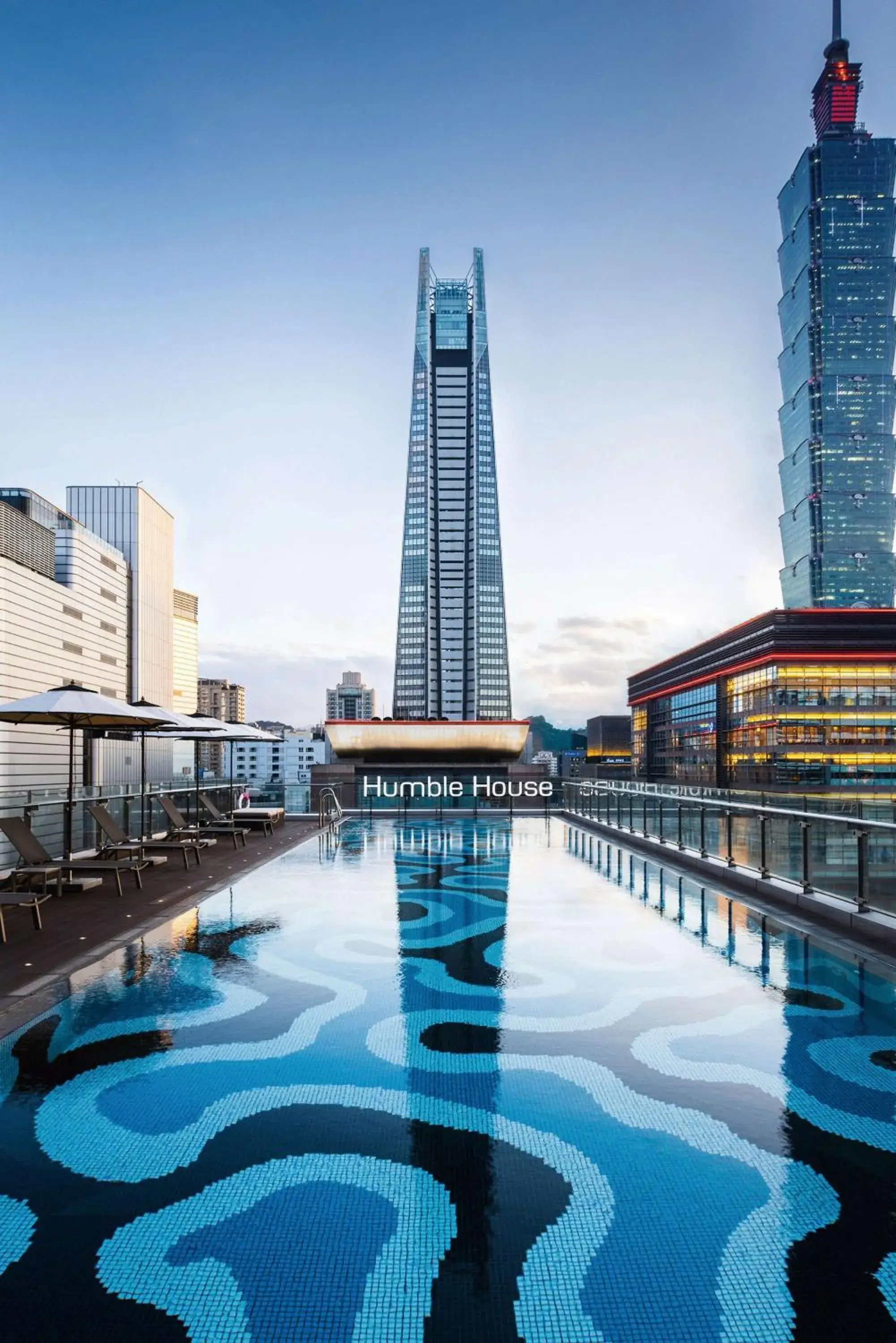 Pool view in Humble House Taipei, Curio Collection by Hilton Pool view in Humble House Taipei, Curio Collection by Hilton