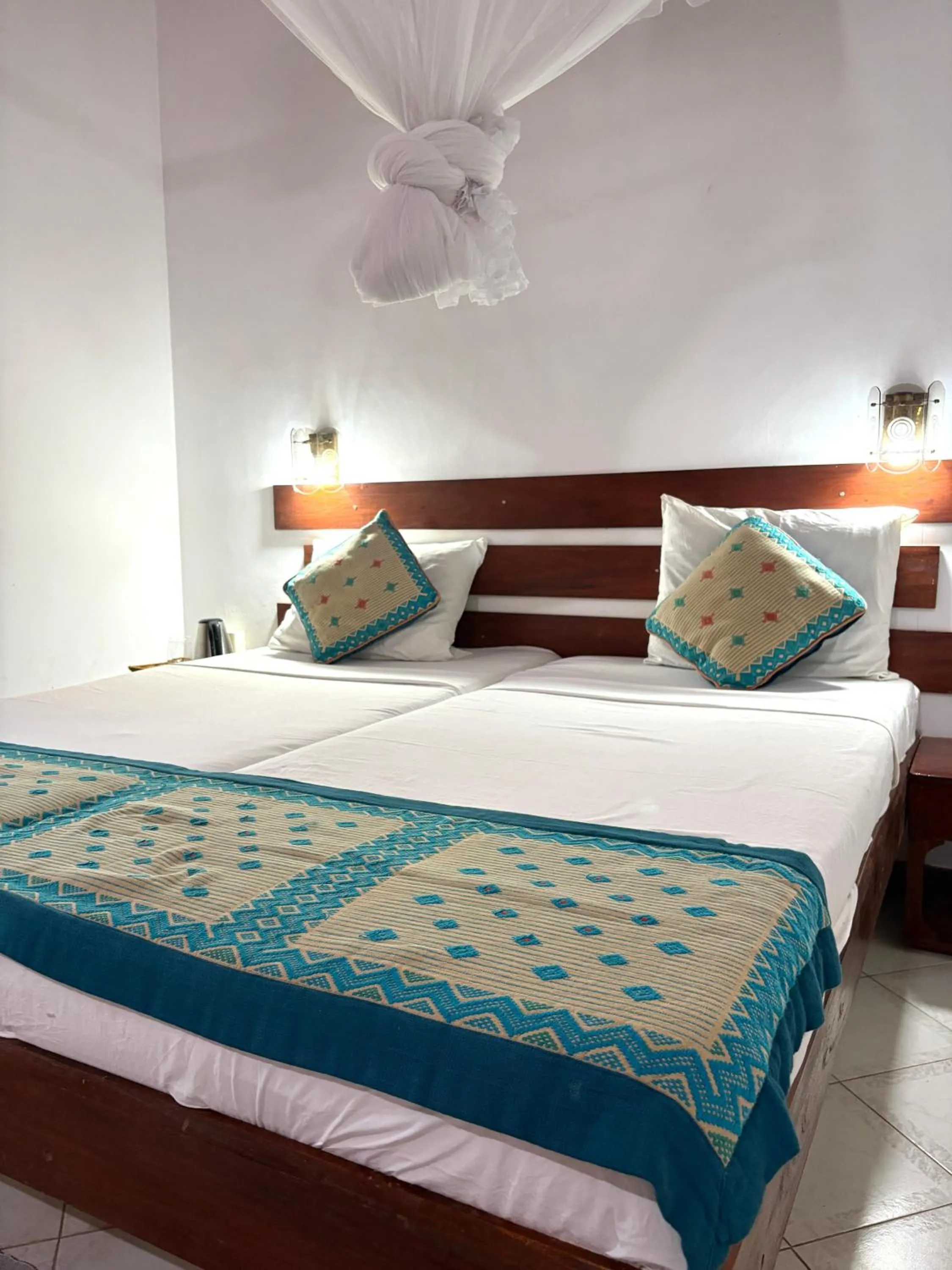 Bed in Chaya Villa Guest House