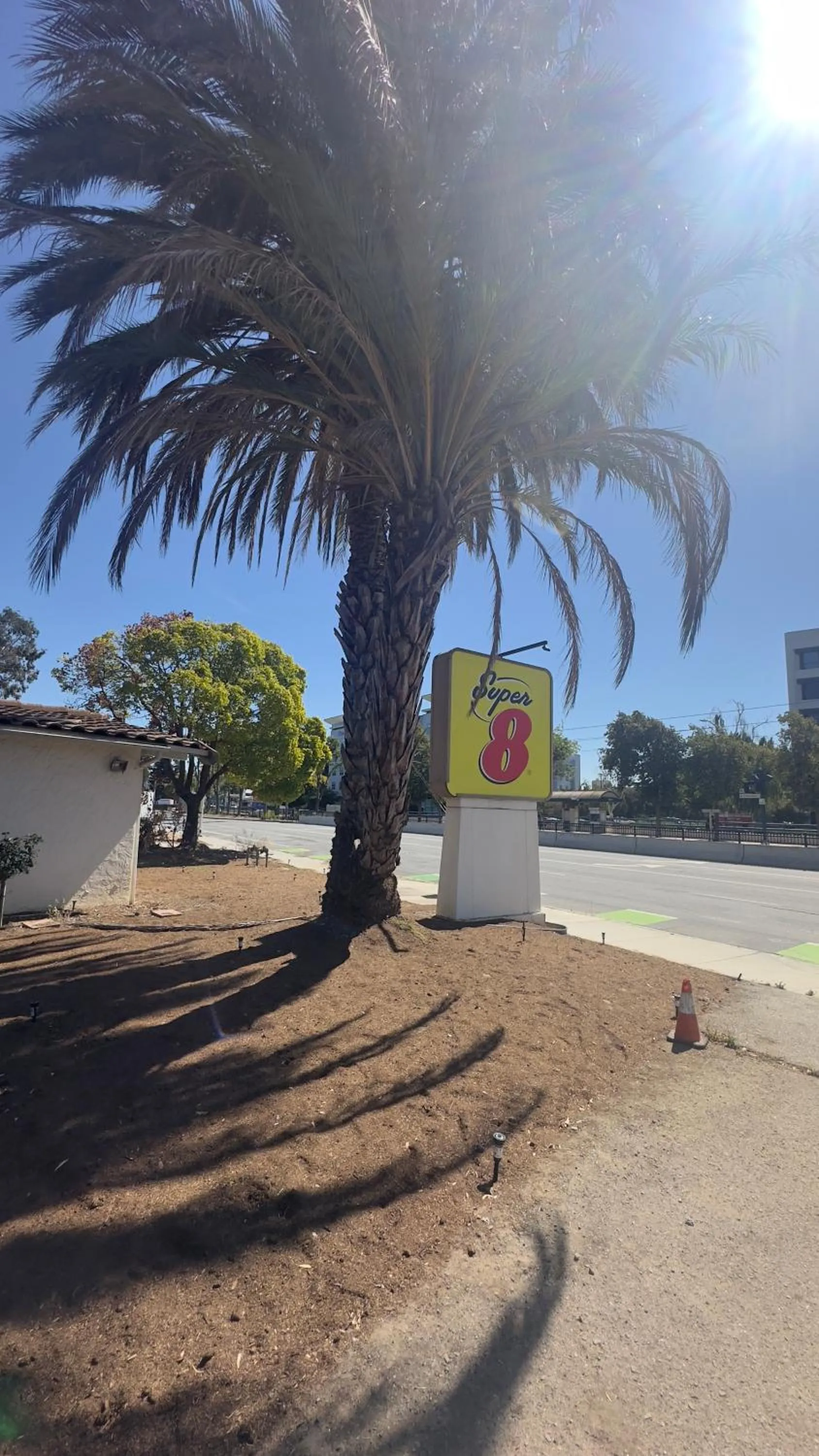Property logo or sign in Super 8 by Wyndham San Jose Airport