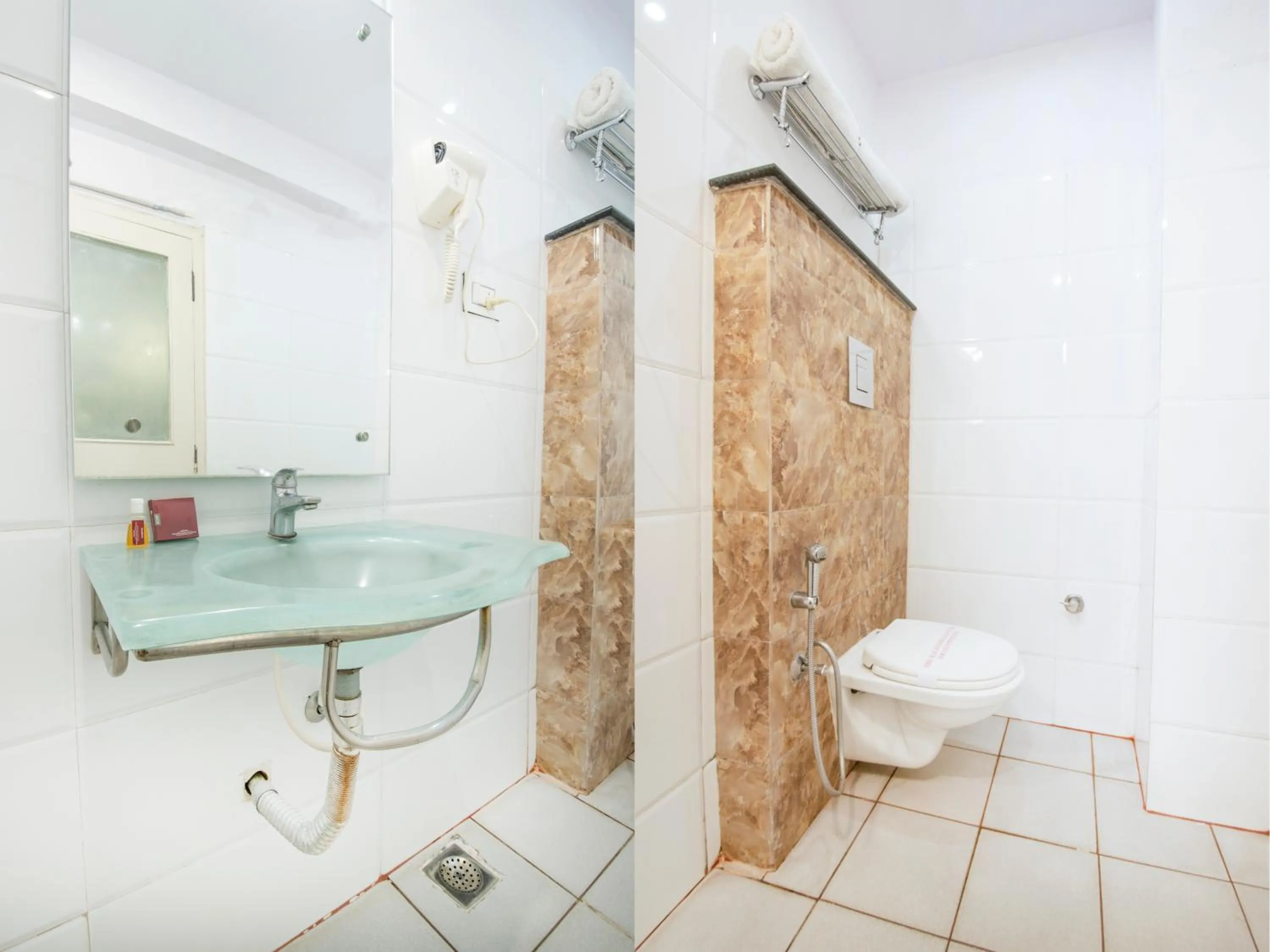 Shower in Aishwarya Suites