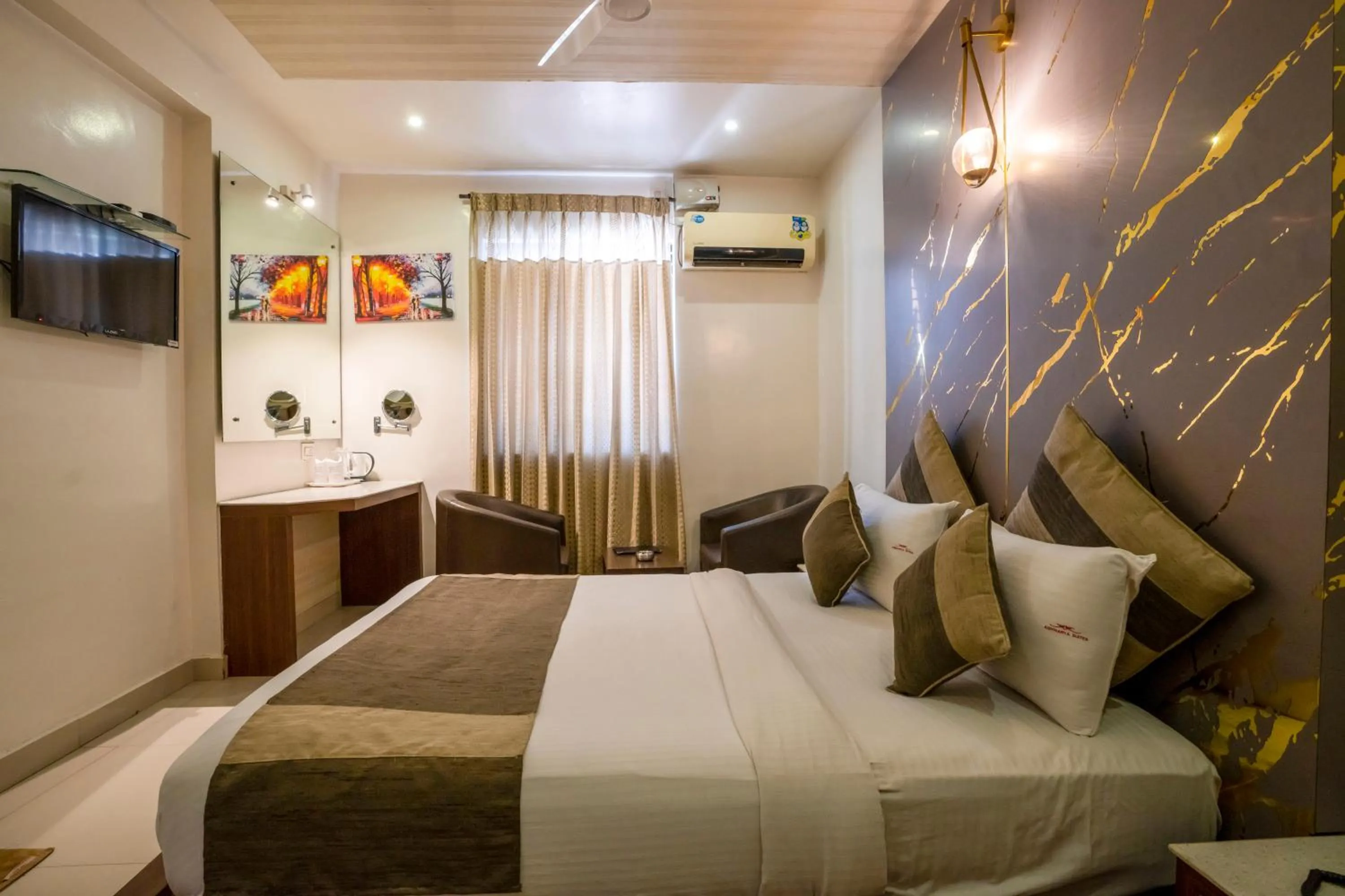 Bed in Aishwarya Suites