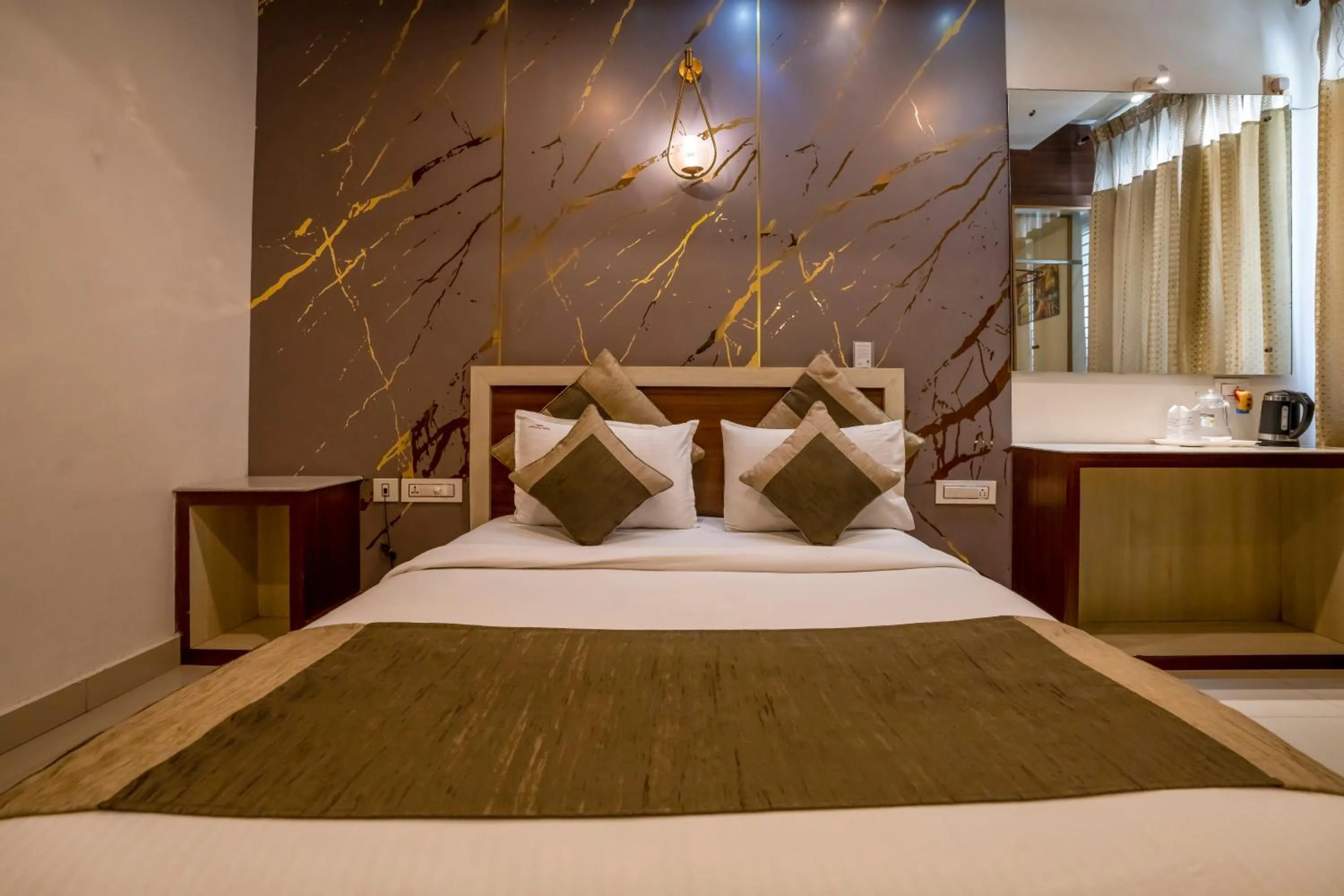 Bed in Aishwarya Suites