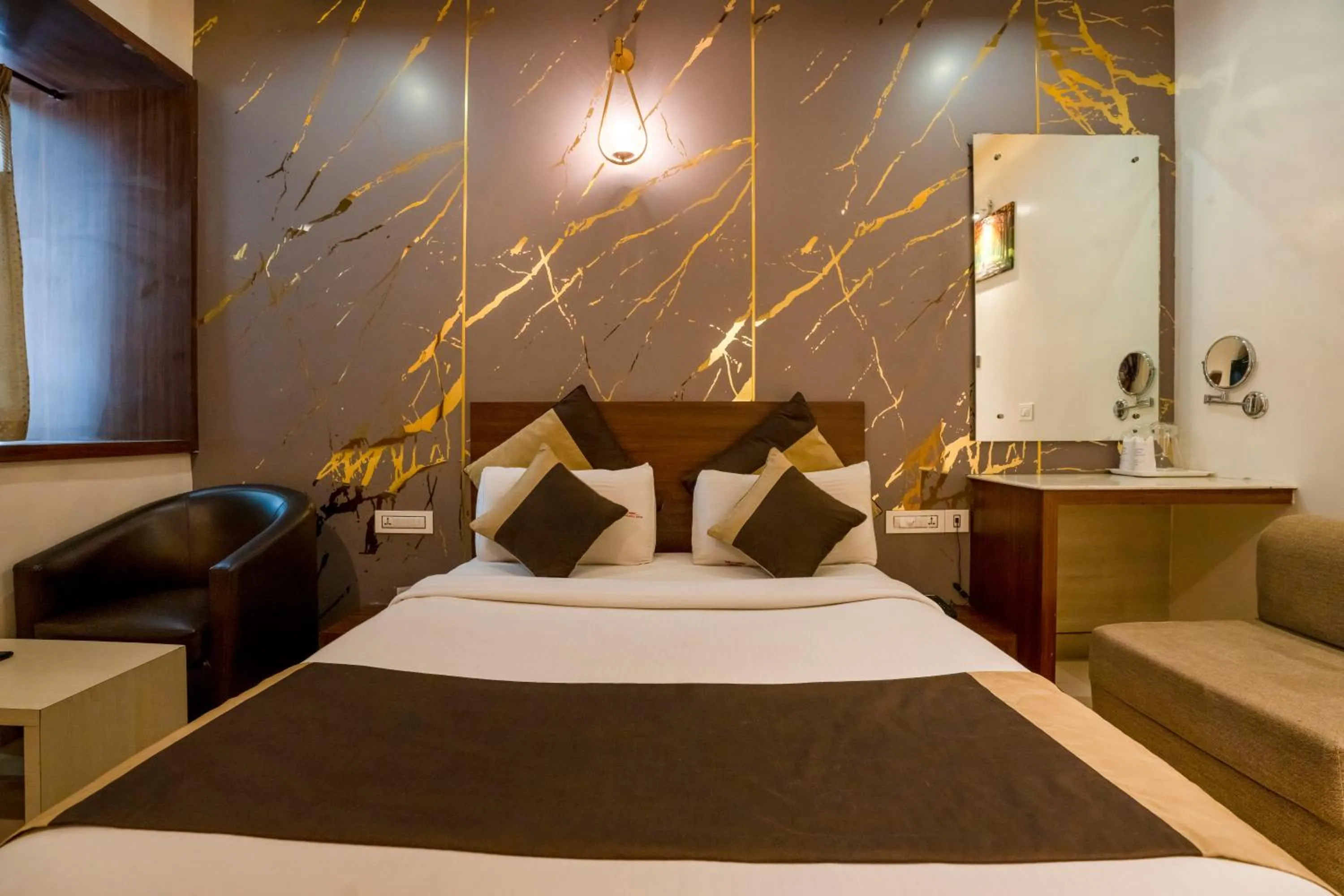 Bed in Aishwarya Suites