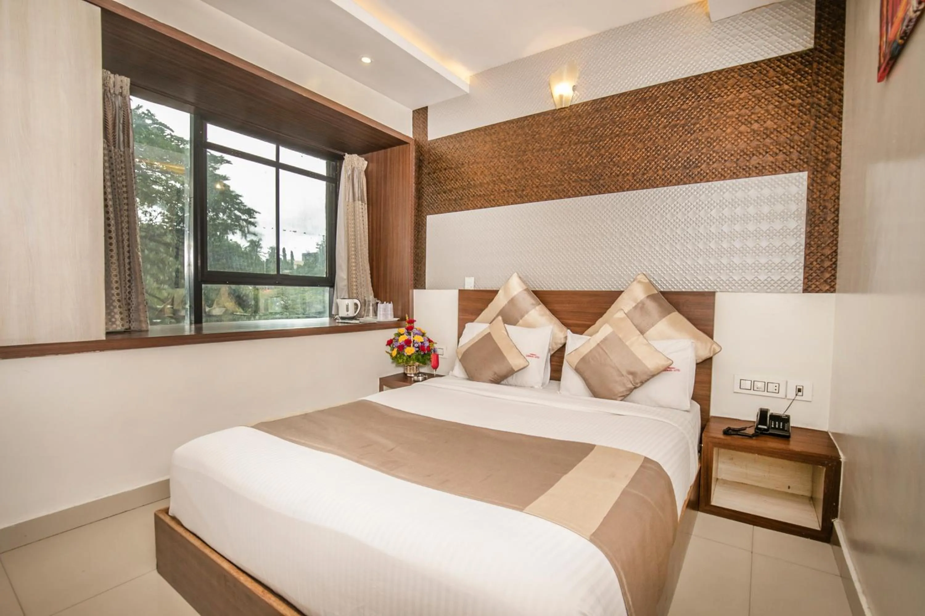 Bed in Aishwarya Suites