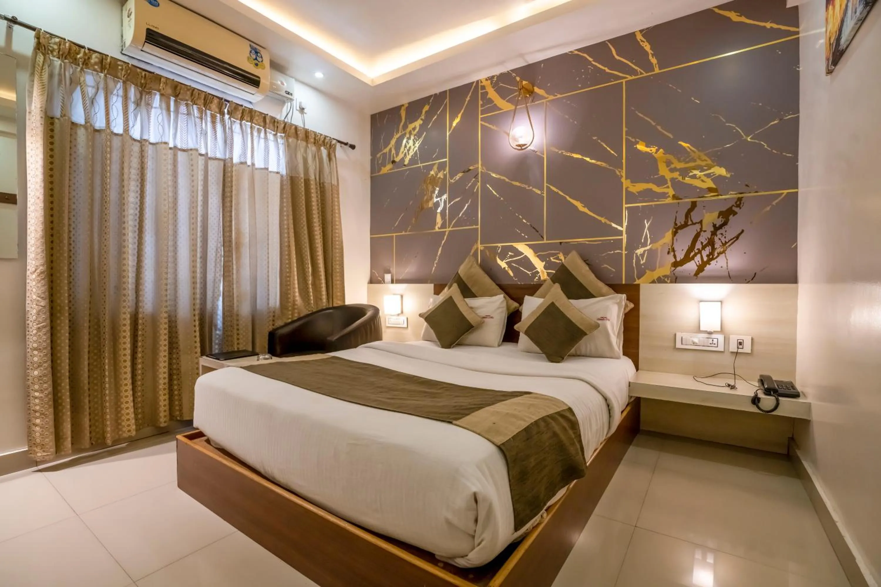 Bed in Aishwarya Suites