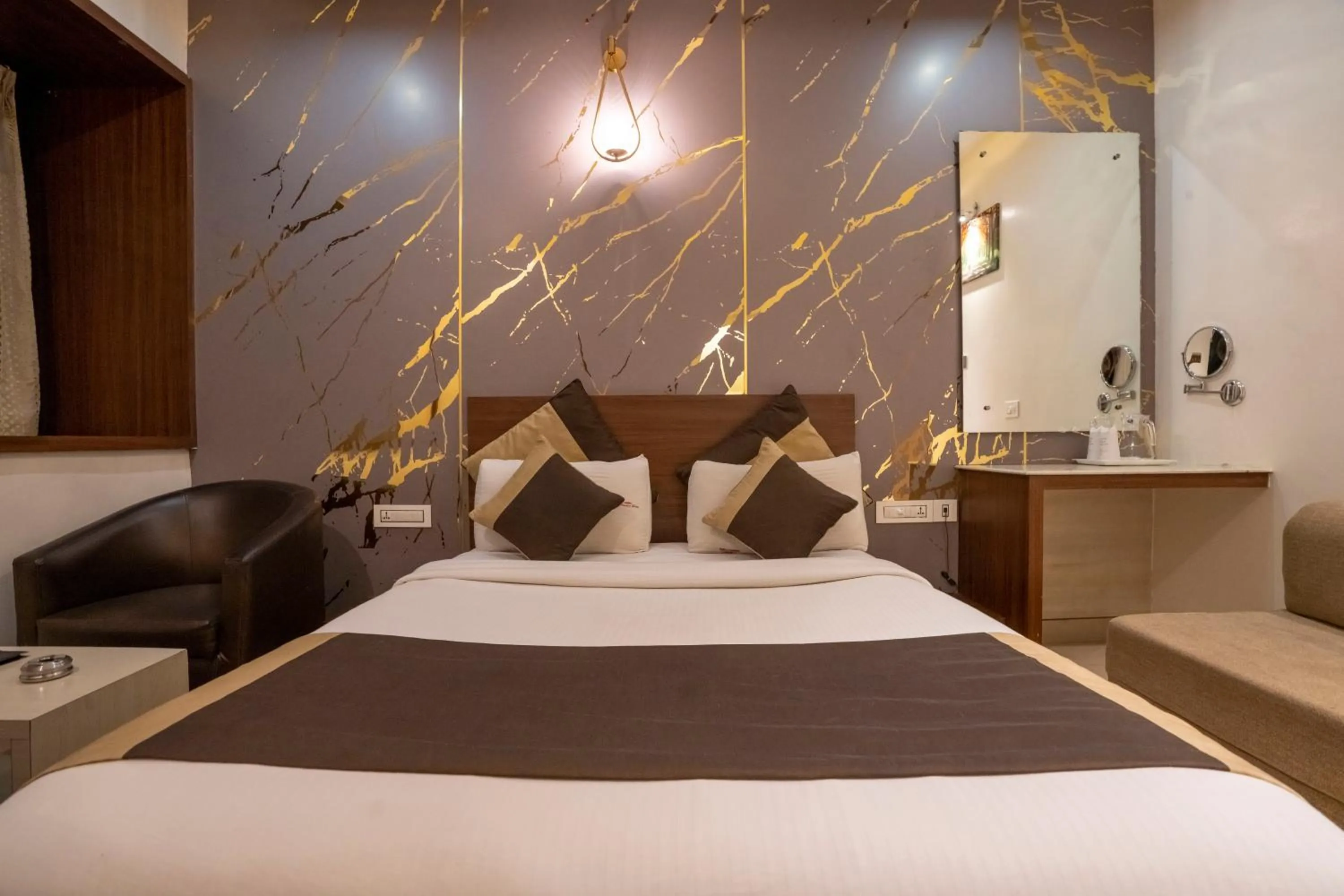 Bed in Aishwarya Suites