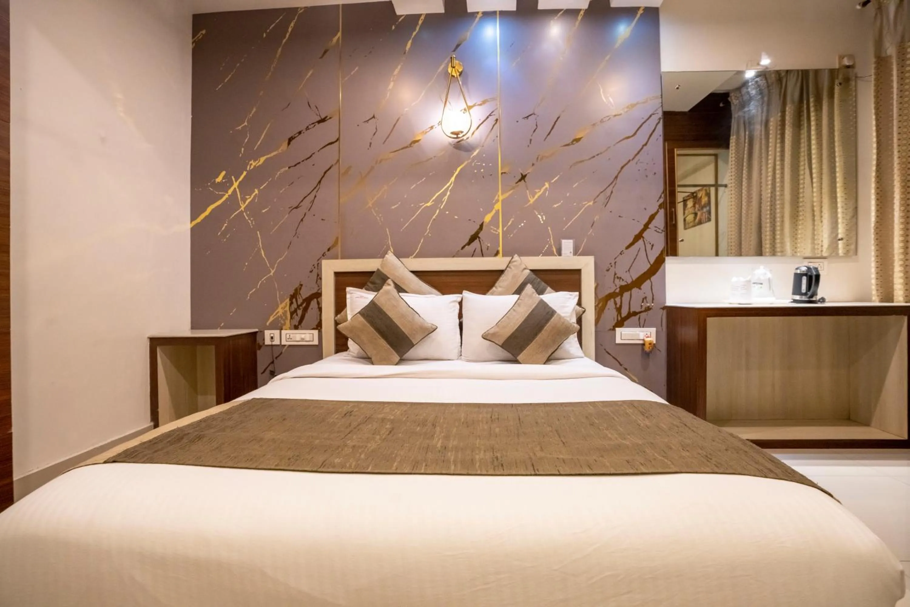 Bed in Aishwarya Suites