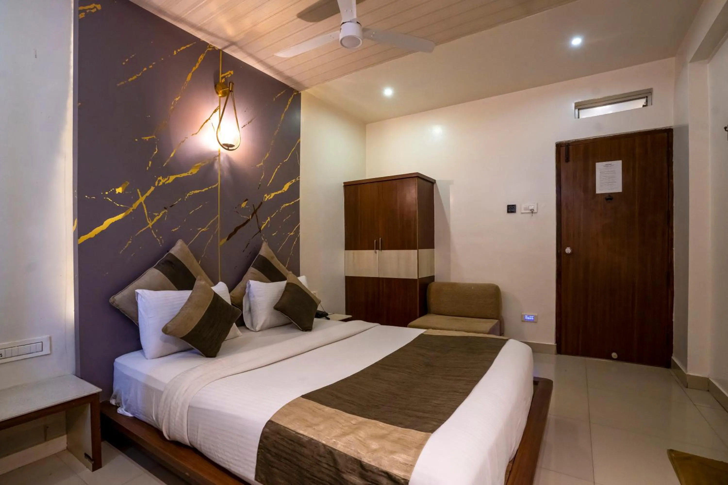 Bed in Aishwarya Suites