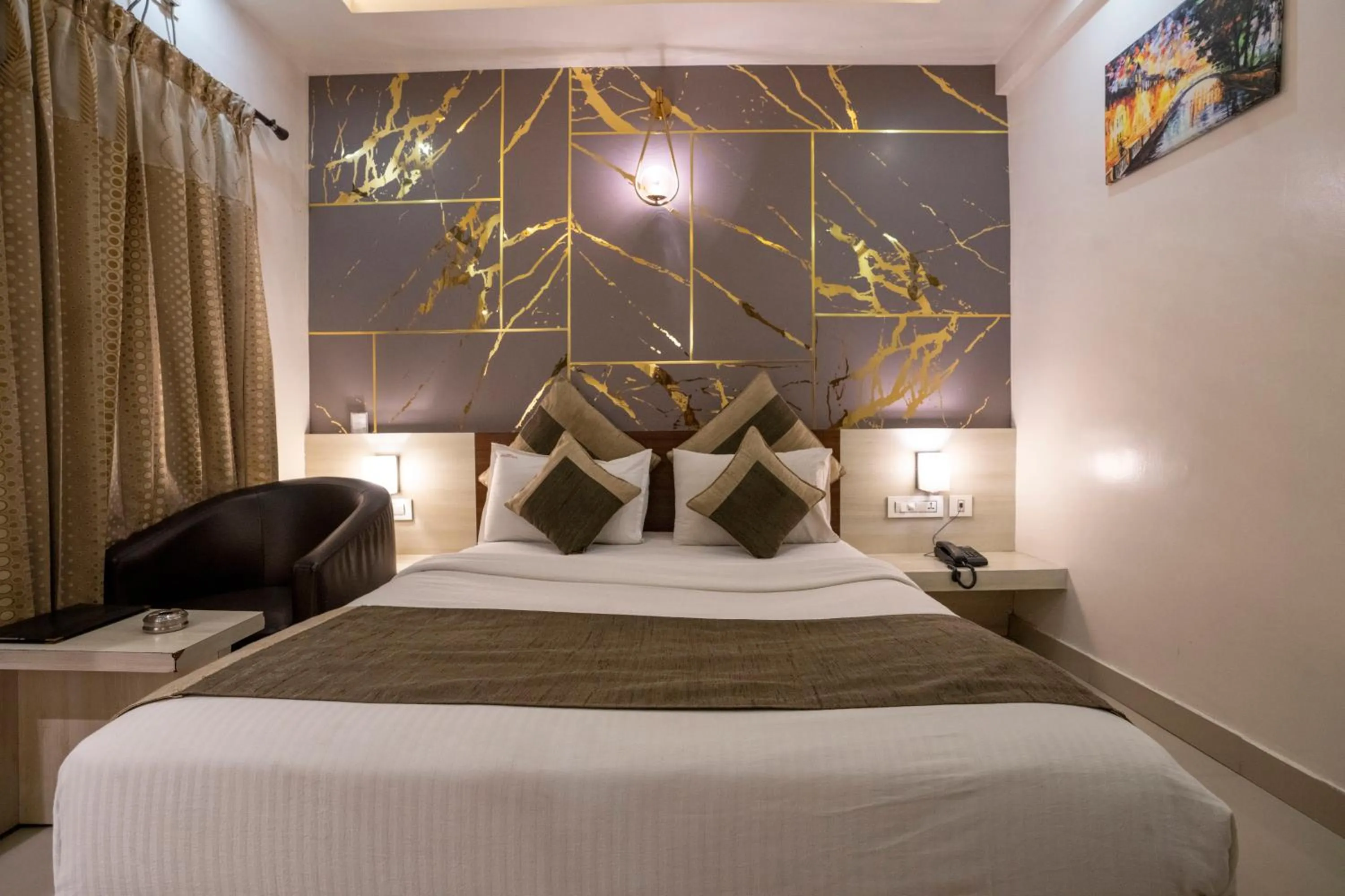 Bed in Aishwarya Suites