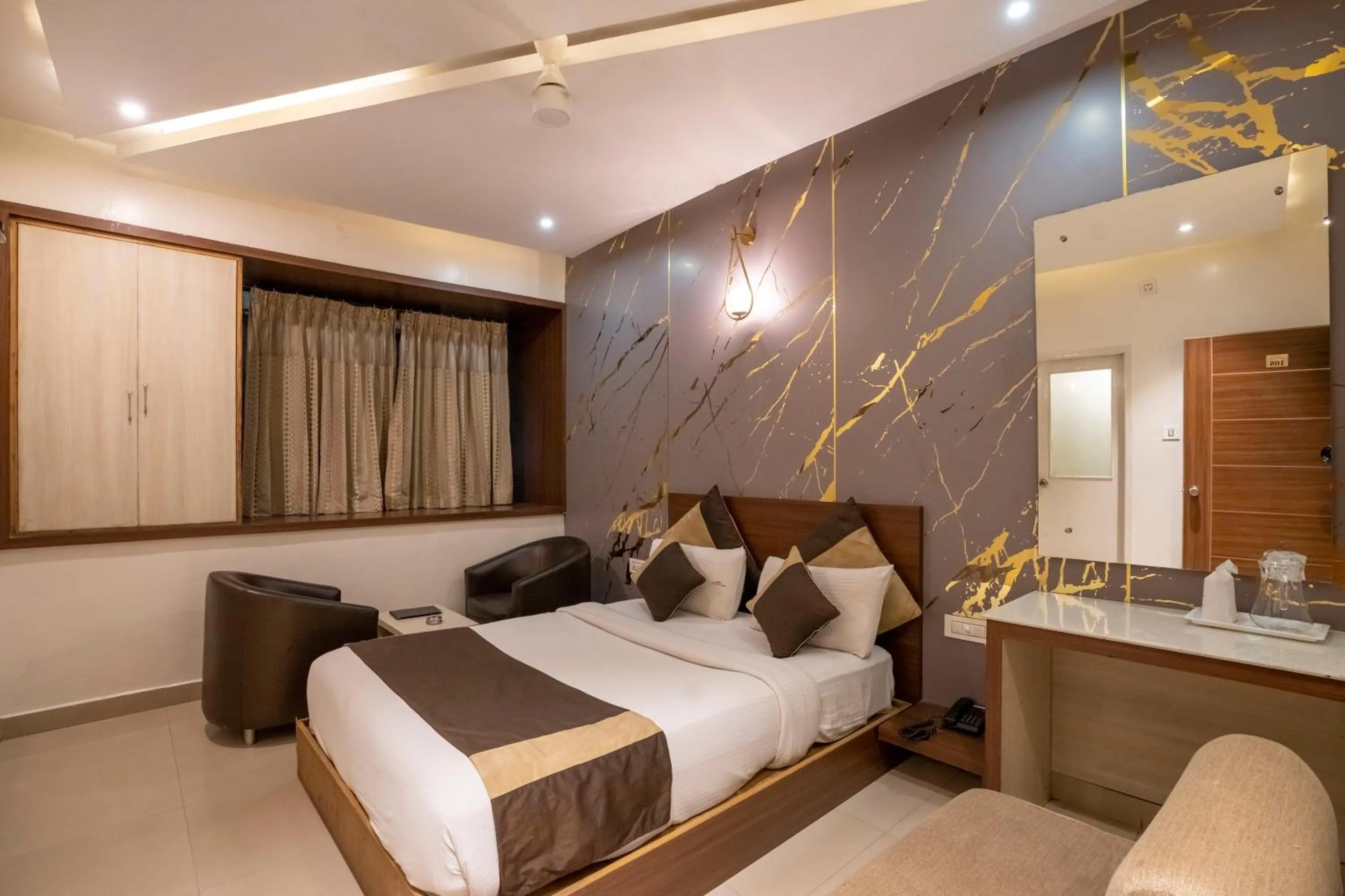 Bed in Aishwarya Suites