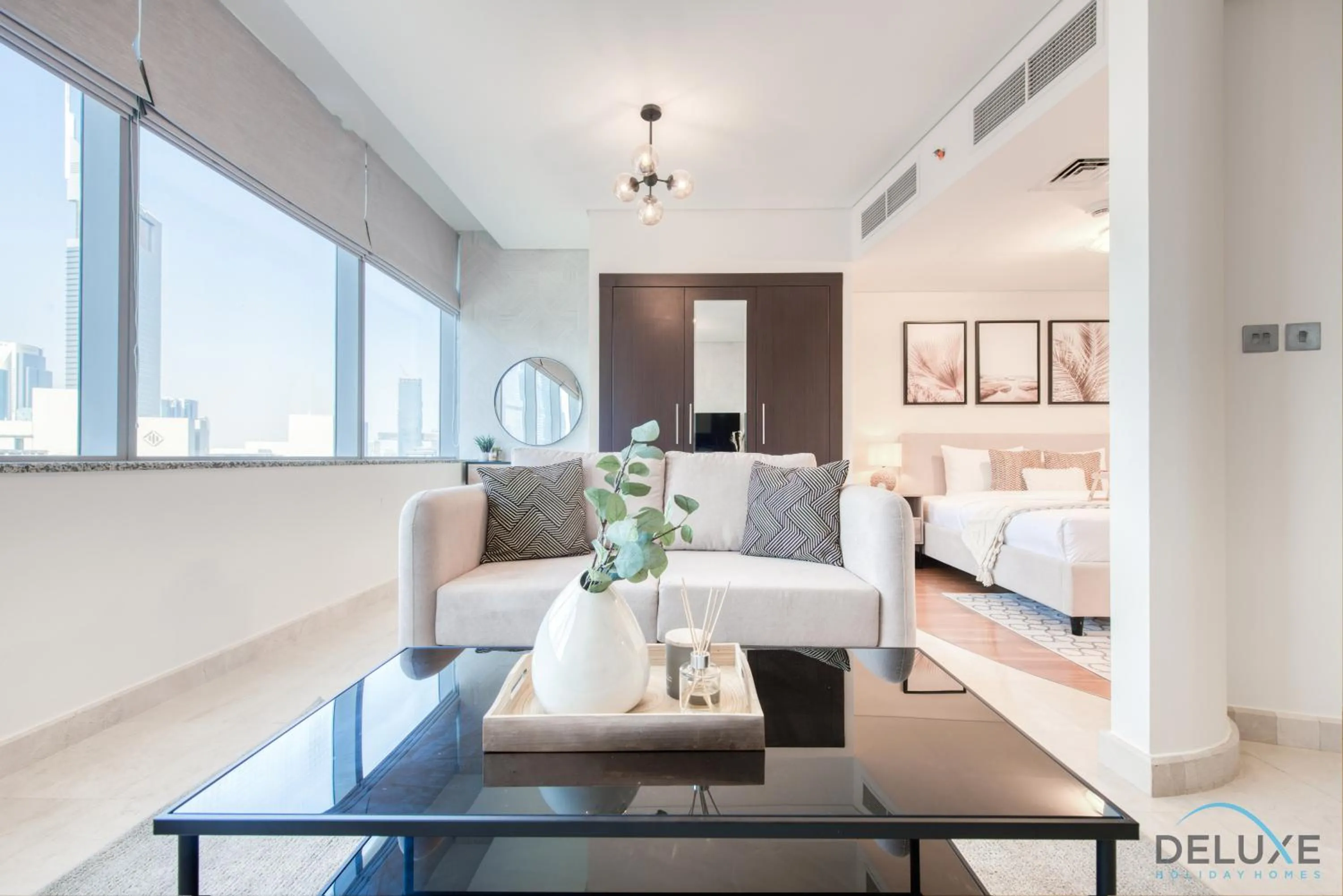Living room, Bed in Calm Studio at Sky Gardens DIFC by Deluxe Holiday Homes