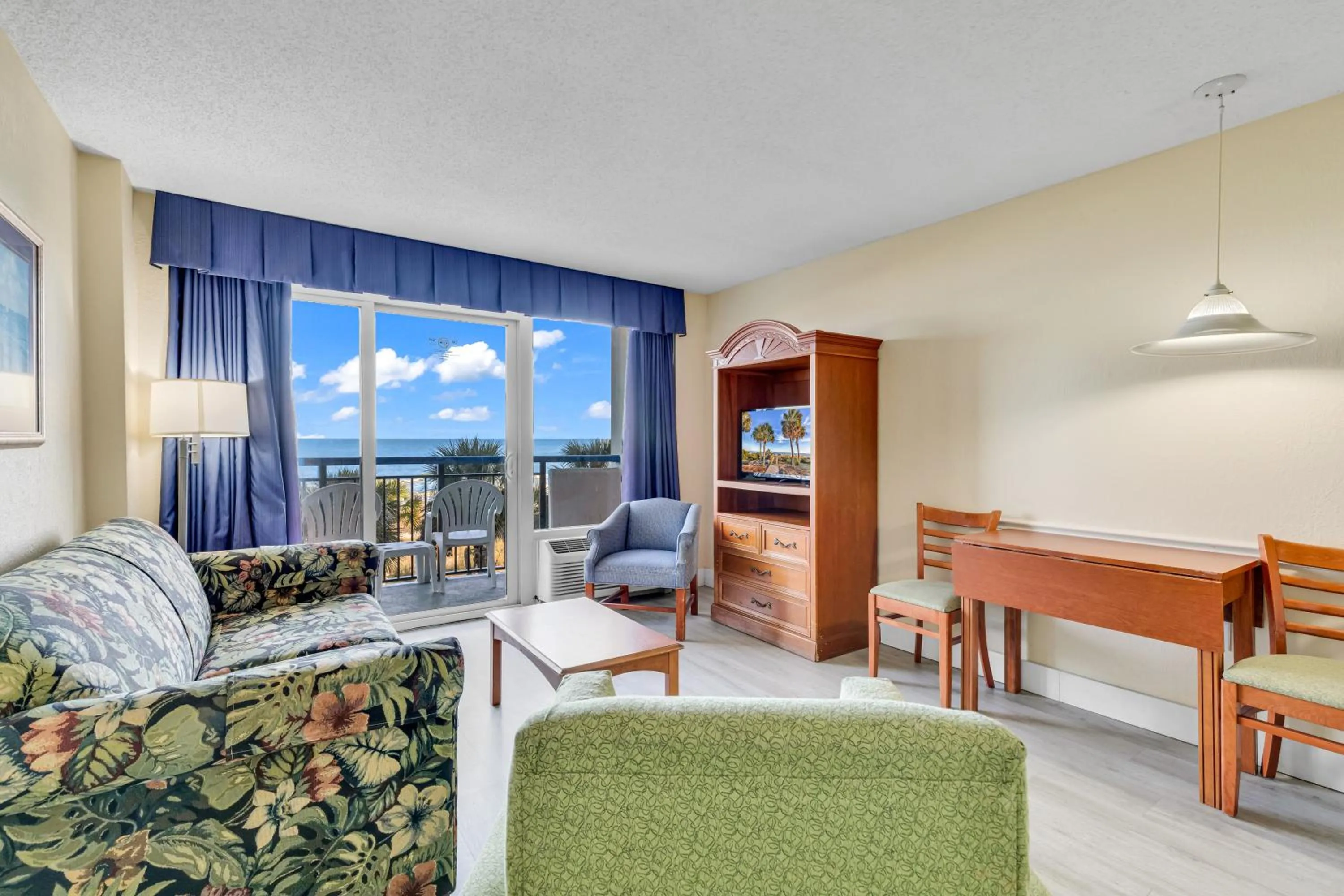 Living room in Oceanfront Boardwalk Condo w Private Balcony and Beach