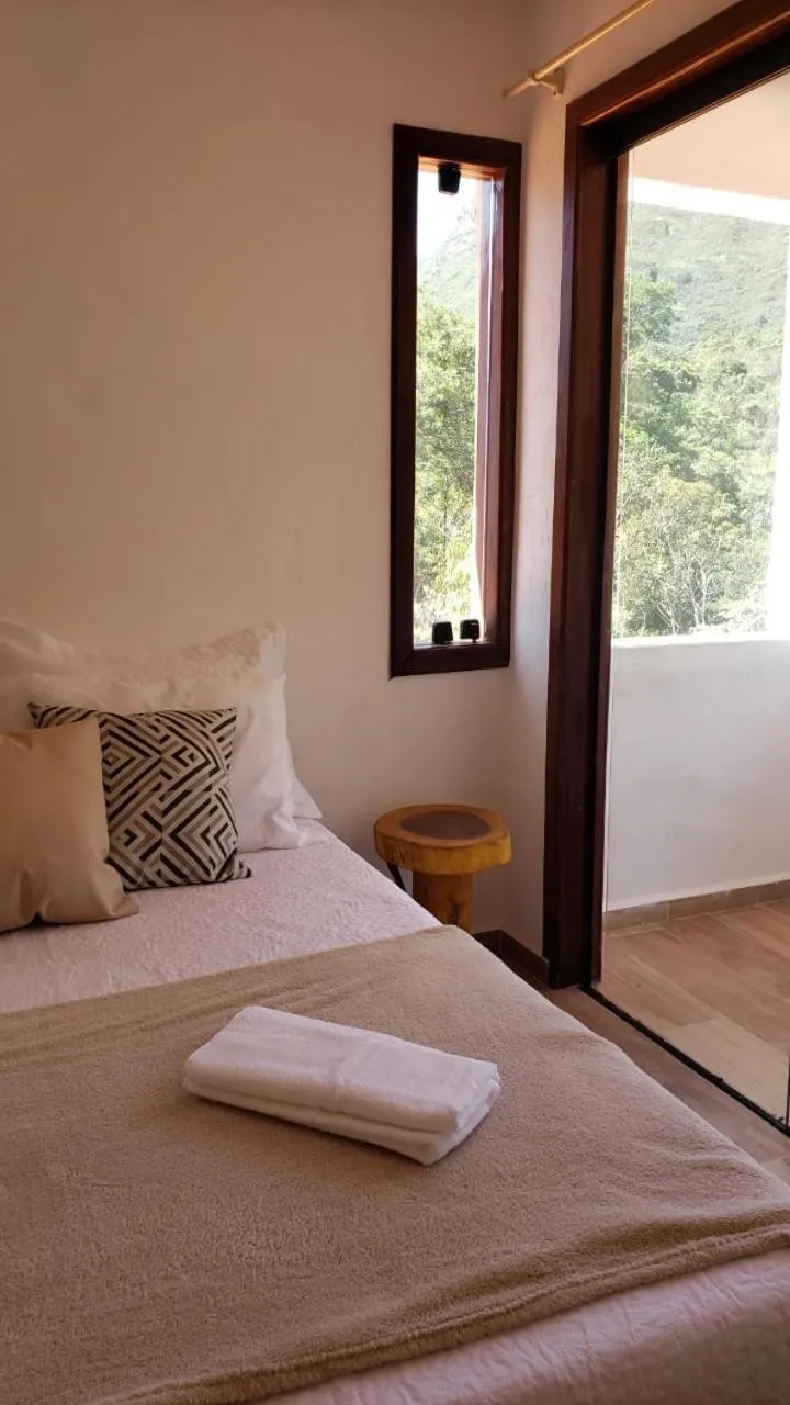 Bed in Pousada Canto das Cachoeiras