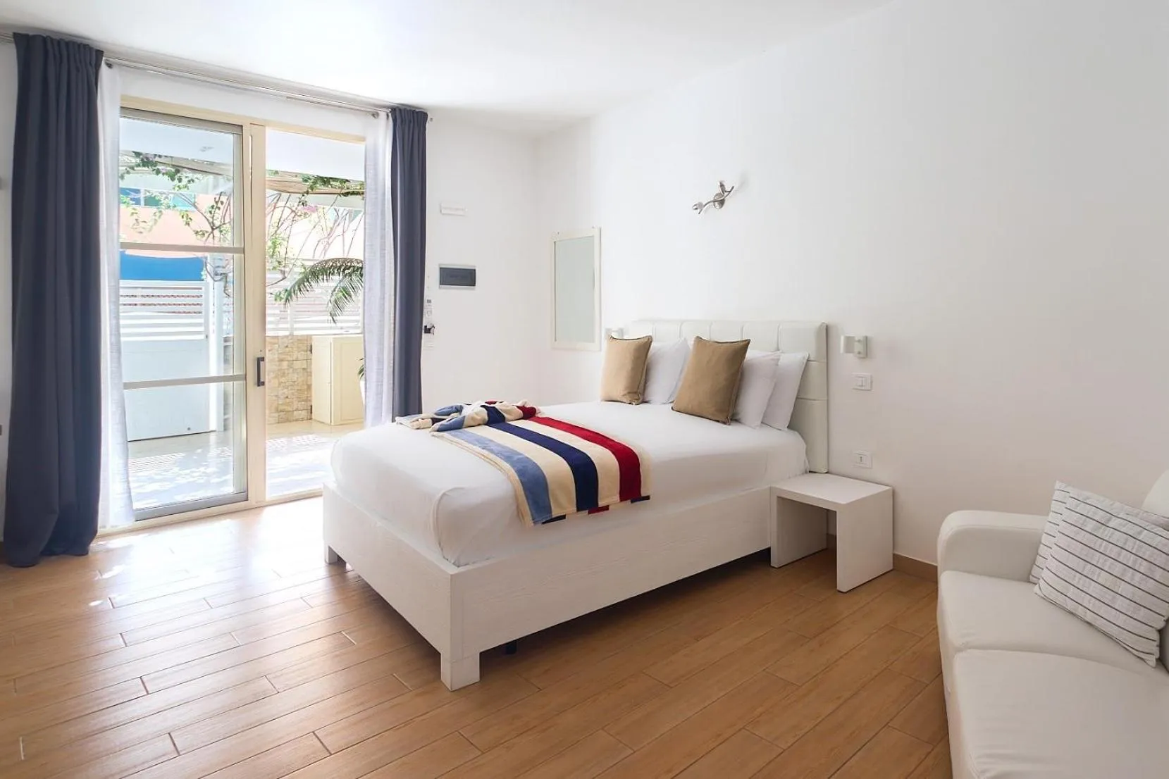 Bed in Branco Suites - Rooms & Holiday Apartments