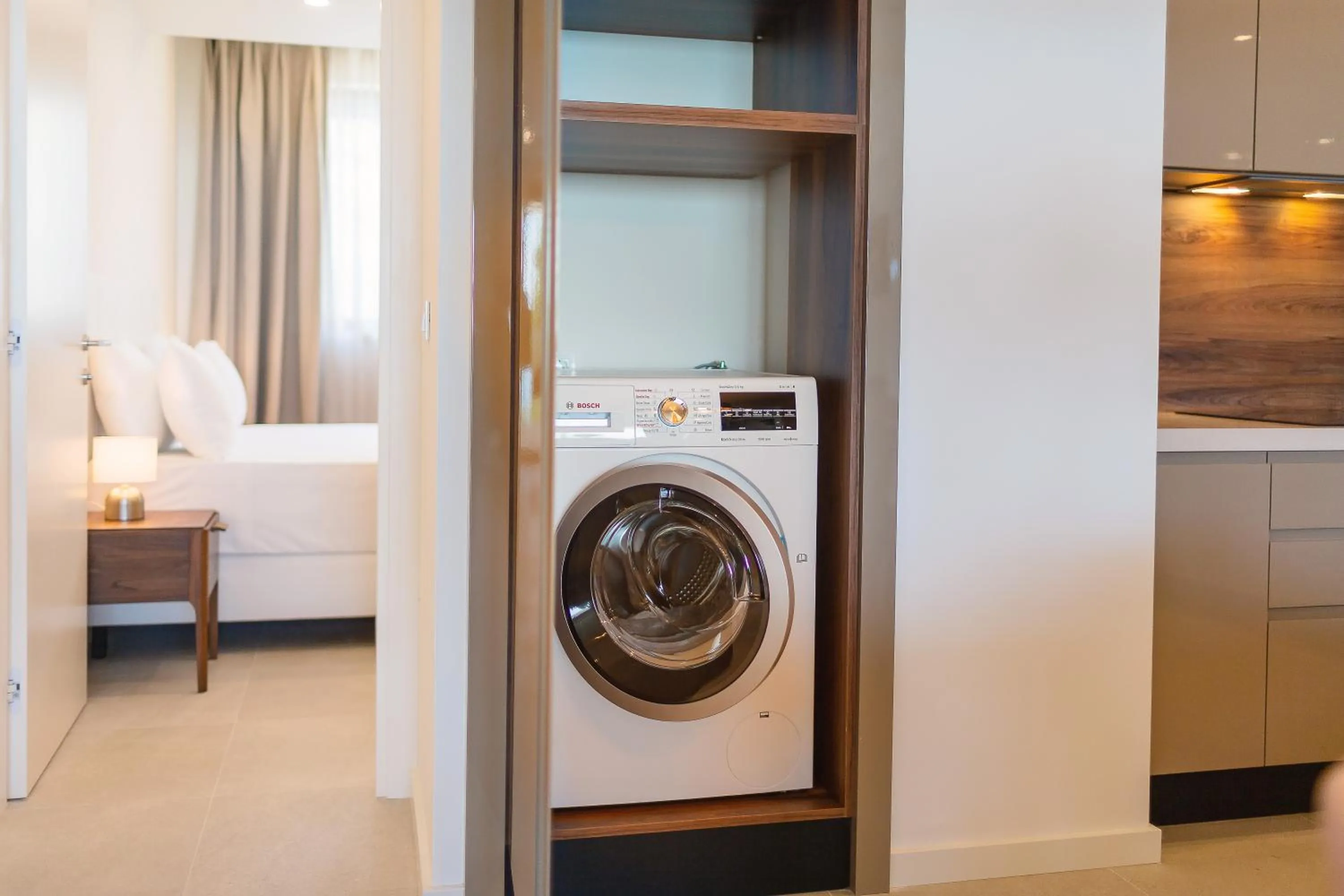 washing machine, Bed in Sunraf Luxe Apartments