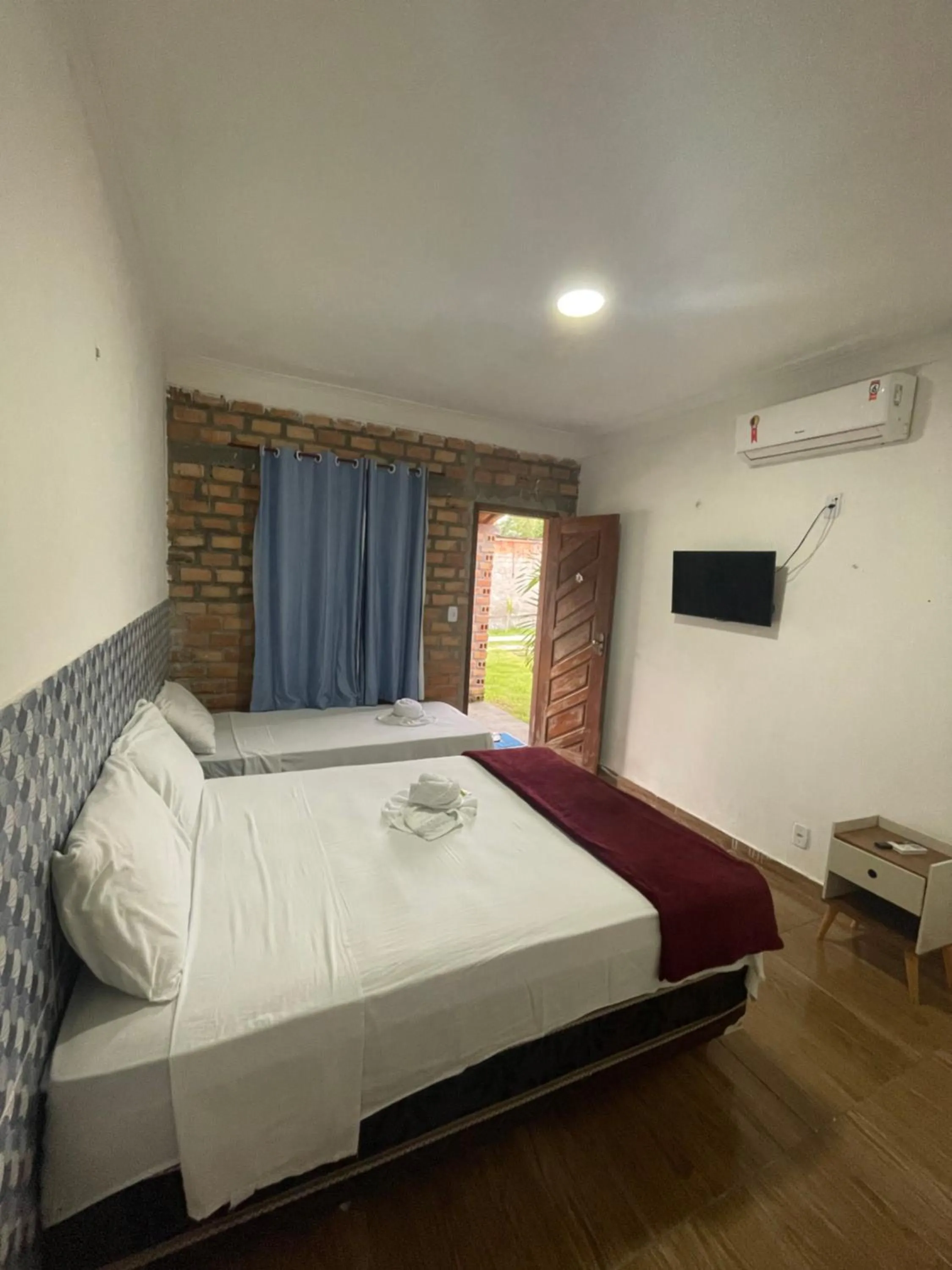 Bed in Pousada RIOSTOUR